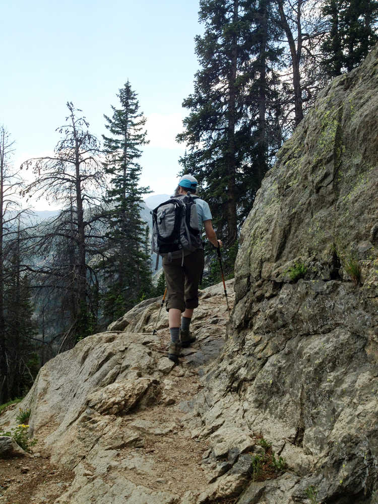 This July 19, 2014 photo shows typical terrain in the Bear Lake Corridor Trails area in Rocky Mountain National Park in Colorado. The corridor offers good day hikes in the eastern side of the park, using the town of Estes Park as a gateway. The park is launching a yearlong celebration of its centennial in September, and fall is a nice time to visit. (AP Photo/Lindsey Tanner)