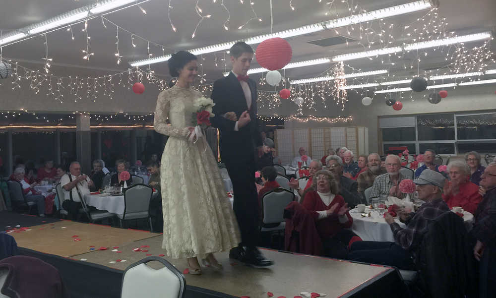 Vintage wedding fashions are modeled during the Kenai Senior Center's Valentine's Day dinner Friday. (Photo by Ian Foley/Peninsula Clarion)