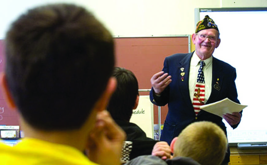 Clarion file photo In this April 2011 file photo, Herb Stetler teaches a Soldotna Elementary School class how to properly fold an American flags. Stetler conceived of a project to bring an "Iron Mike" statue to Soldotna to memorialize military servicemen.