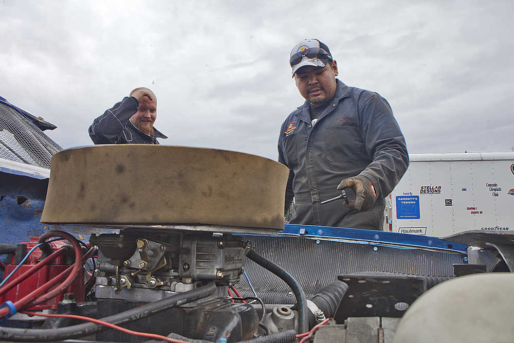 Photo by Rashah McChesney/Peninsula Clarion Ashten Jones, of Palmer, climbs out of her car after spending a few laps familiarizing herself with the Twin City Raceway dirt track on May 23, 2015 in Kenai, Alaska.