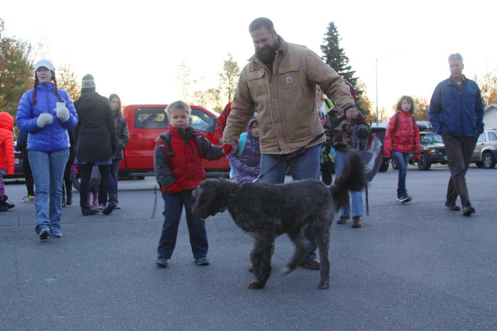 Families bring pets along on Walk to School day.