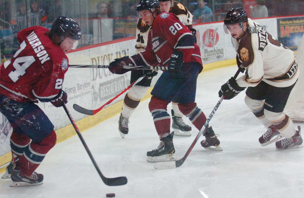 Ben Boettger/Peninsula Clarion In this Jan. 16, 2015 file photo Adam Anderson and Cameron Cook of Fairbanks play against Sam Carlson and Evan Butcher of Kenai at a hockey game at the Soldotna Regional Sports Complex.