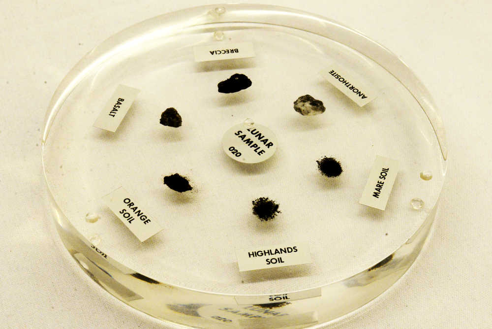 Ben Boettger/Peninsula Clarion Embedded in a glass disk, six samples of lunar material visited the Challenger Learning Center on Thursday, Jan. 29 in Kenai. The samples have since been returned to NASA.