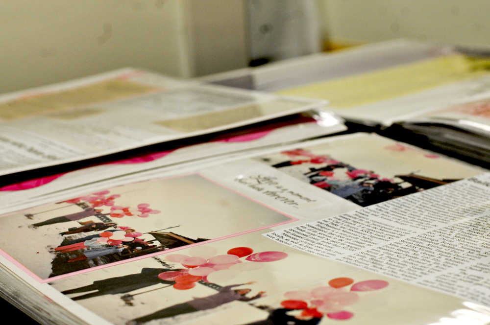 Photo by Elizabeth Earl/Peninsula Clarion A scrapbook details the history of Hospice of the Central Peninsula at the nonprofit's 30th anniversary event at Central Peninsula Hospital on Friday, Nov. 18, 2016 in Soldotna, Alaska.