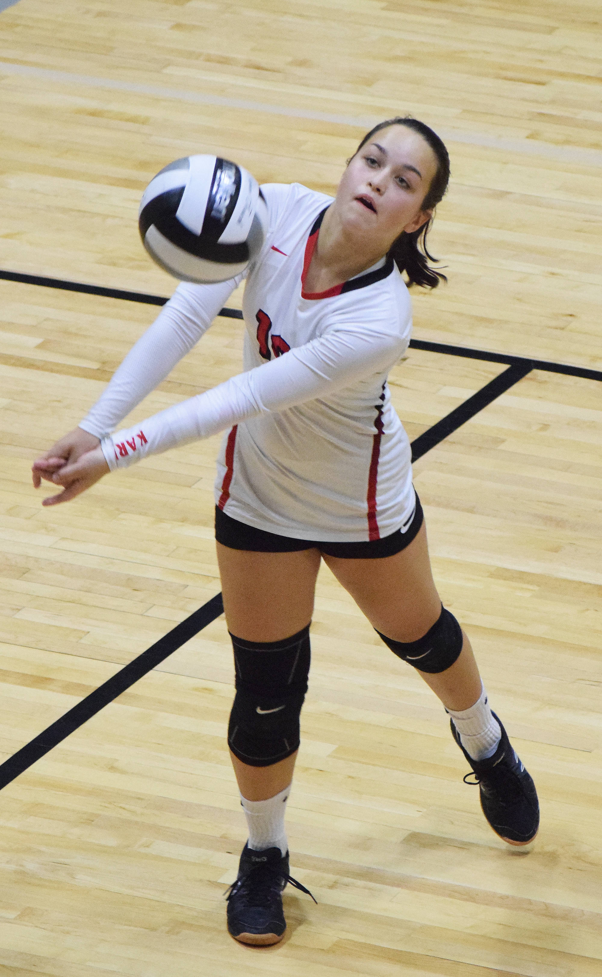 Kenai freshman Jenna Streiff lifts the ball Saturday at the Shayna Pritchard Memorial tournament at Nikiski High School. (Photo by Joey Klecka/Peninsula Clarion)