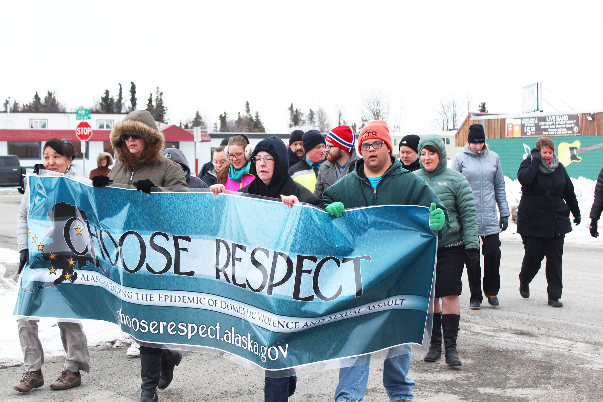 Residents march into the Kenai Chamber of Commerce and Visitor Center parking lot during the annual Choose Respect event Thursday, March 30, 2017 in Kenai, Alaska. Communities across the state march in solidarity with the initiative started in 2009 by former Gov. Sean Parnell. (Megan Pacer/Peninsula Clarion)
