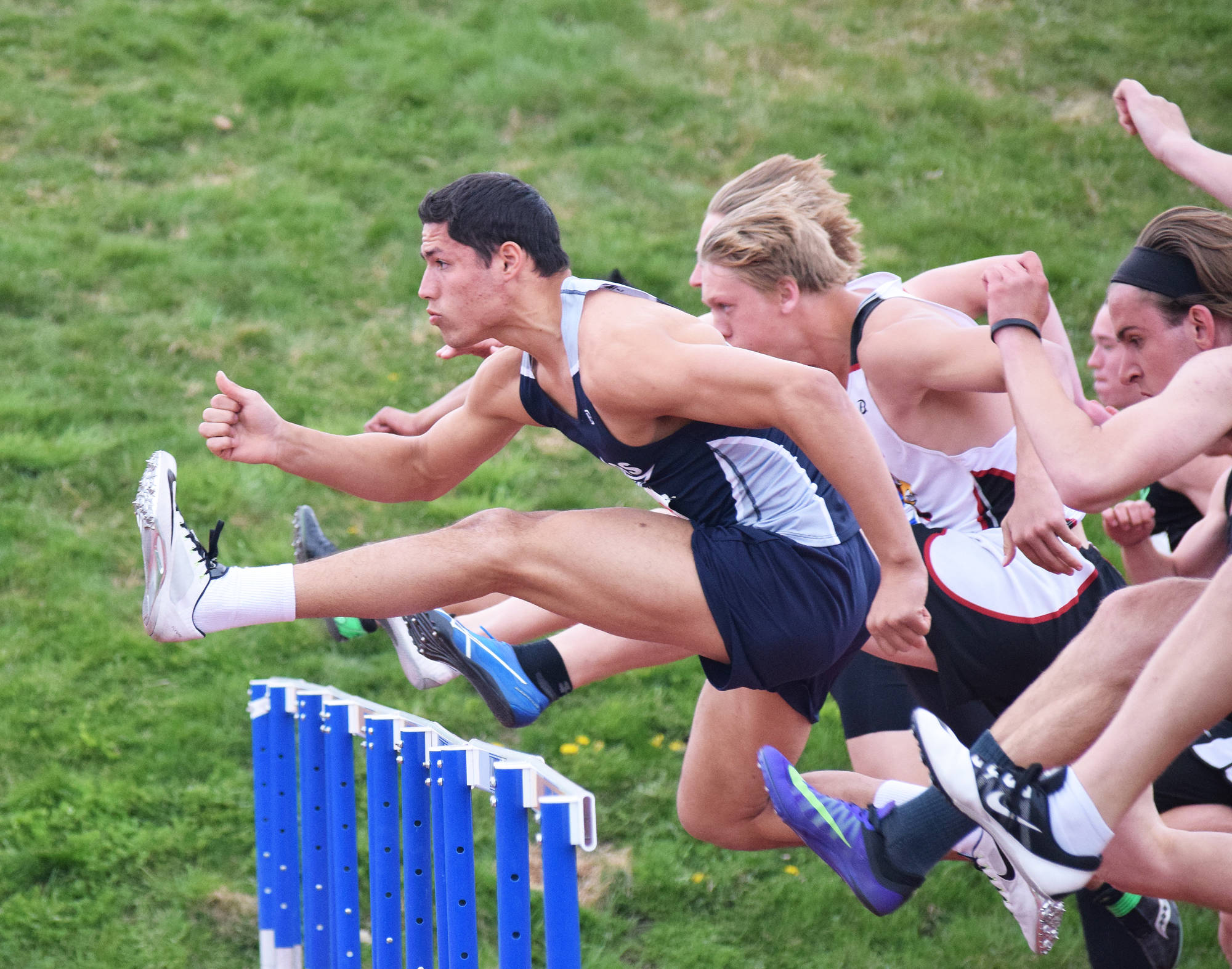 Soldotna senior Abraham Van Hout leads the field over the first barrier in the boys 110-meter hurdles final May 20 at the Region III track & field championships in Homer. (Photo by Joey Klecka/Peninsula Clarion)