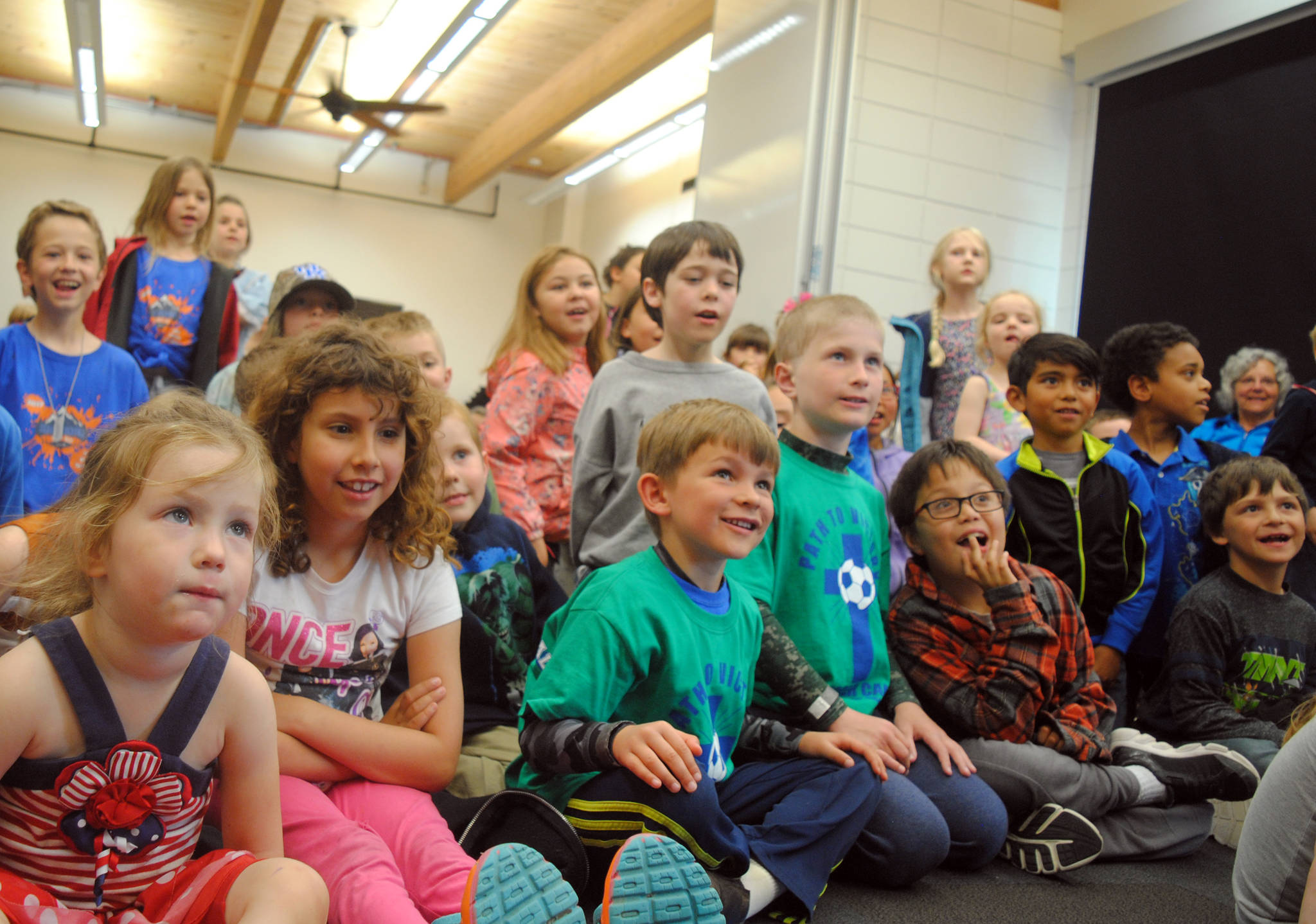 A group of local children react to a magic show held at the Kenai Community Library in Kenai, Alaska on Thursday, June 29, 2017. The magic show was held in conjunction with the library’s summer reading program. The library is hosting weekly events on Thursdays throughout the summer. (Photo by Kat Sorensen/Peninsula Clarion)