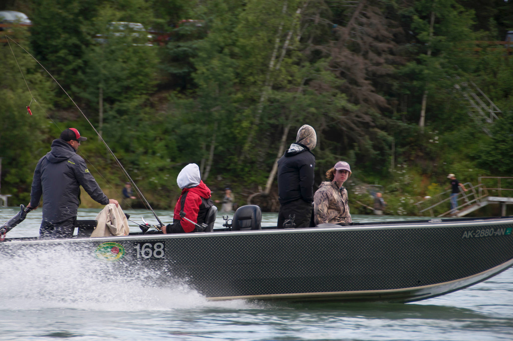 In this July 2016, a fishing guide pilots a boat up the Kenai River near Soldotna, Alaska. (Photo by Elizabeth Earl/Peninsula Clarion, file)