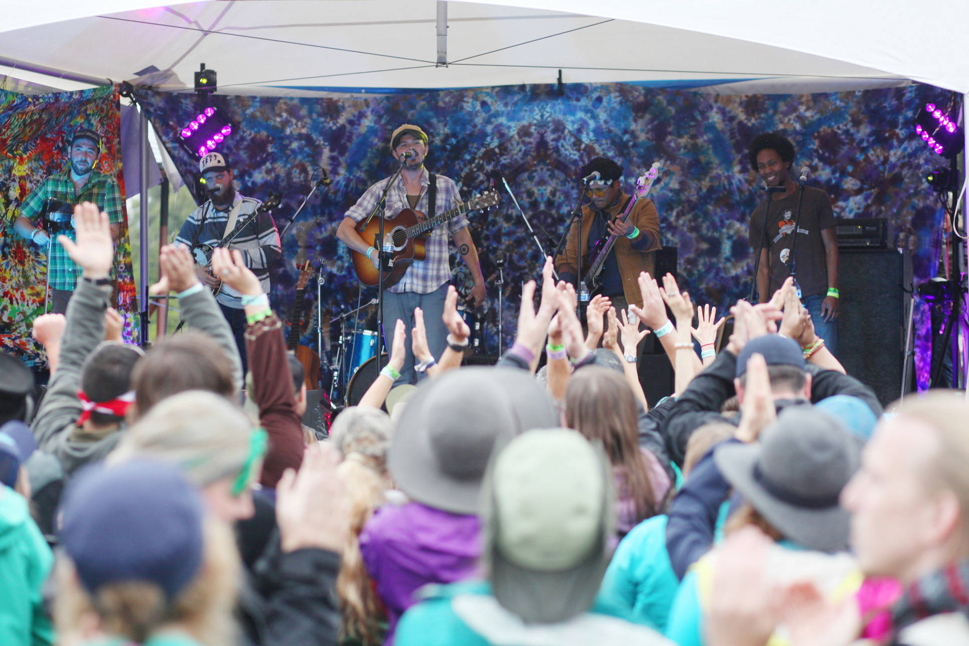 Audience members clap along to the Blackwater Railroad Company’s afternoon performance Aug. 7, 2016 at Salmonfest 2016 in Ninilchik, Alaska. Photo by Kelly Sullivan/ Peninsula Clarion