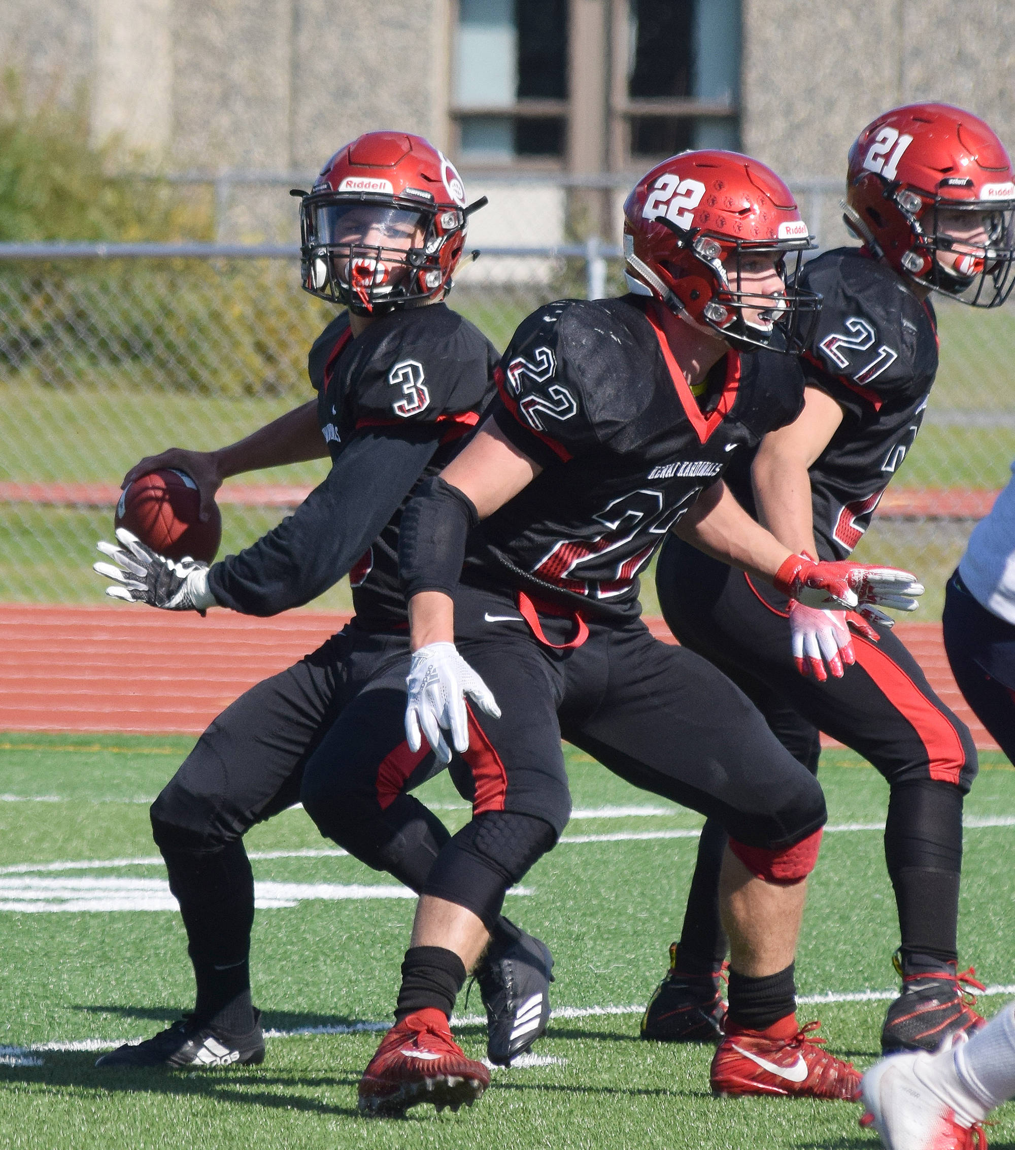 Kenai quarterback Connor Felchle winds up for a pass Saturday against North Pole at Ed Hollier Field in Kenai. (Photo by Joey Klecka/Peninsula Clarion)