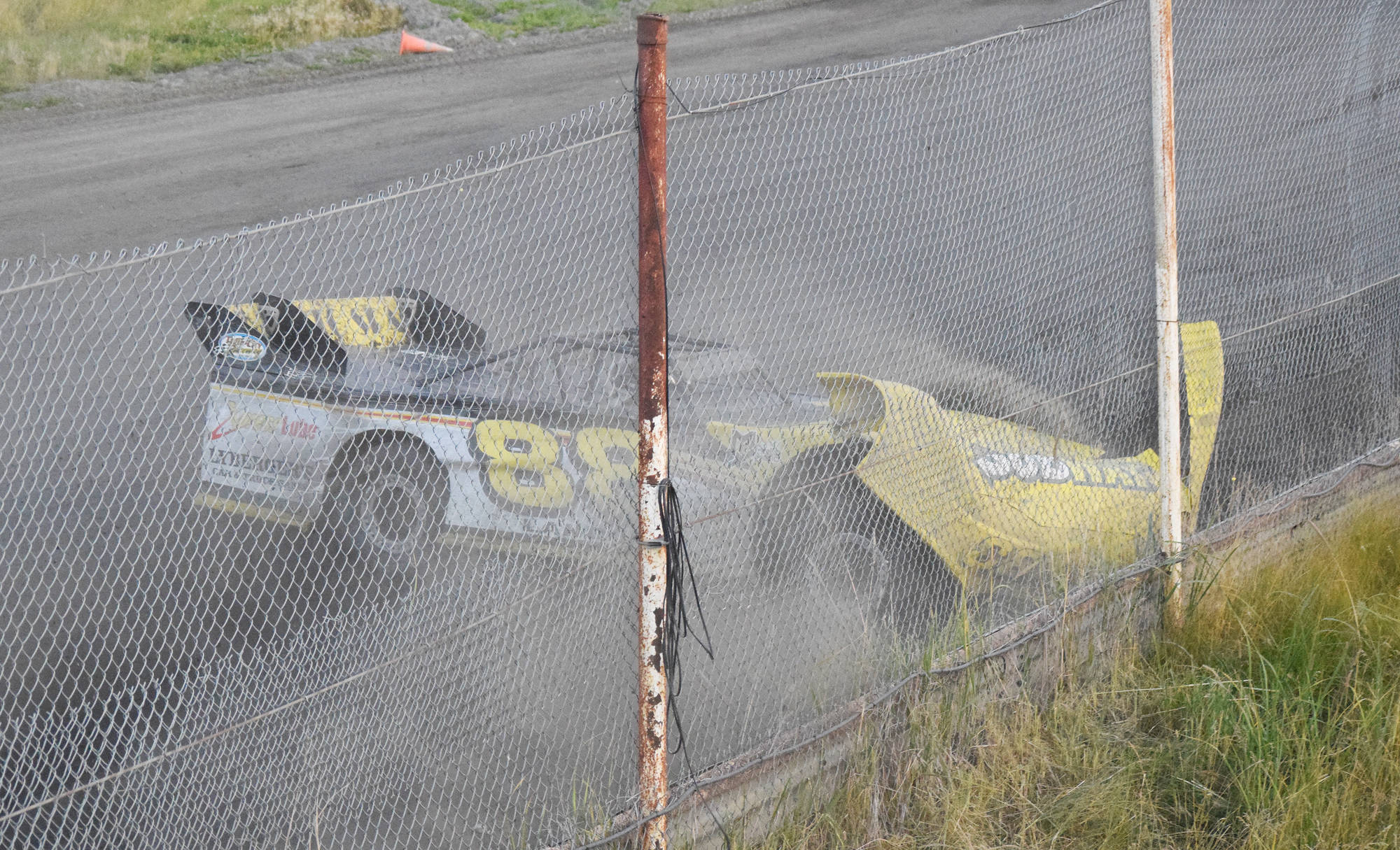 Justin Creech collides with the outside wall Friday night in the Late Model feature event at Twin City Raceway in Kenai. (Photo by Joey Klecka/Peninsula Clarion)