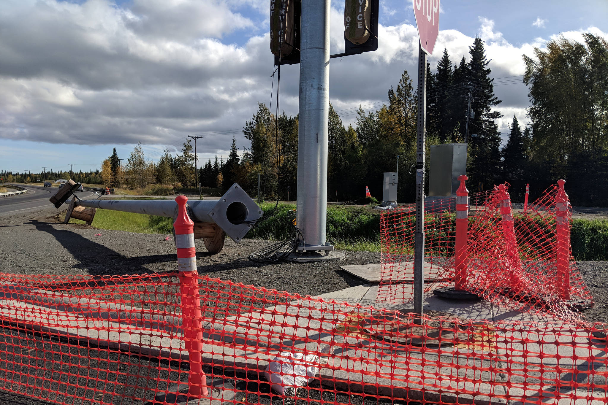 A traffic pole lies on its side in a construction zone at the intersection of Gaswell Road and Kalifornsky Beach Road near Soldotna, Alaska on Sunday, Sept. 23, 2018. Kalifornsky Beach Road is one of several stretches of highway under construction this fall. (Photo by Erin Thompson/Peninsula Clarion)