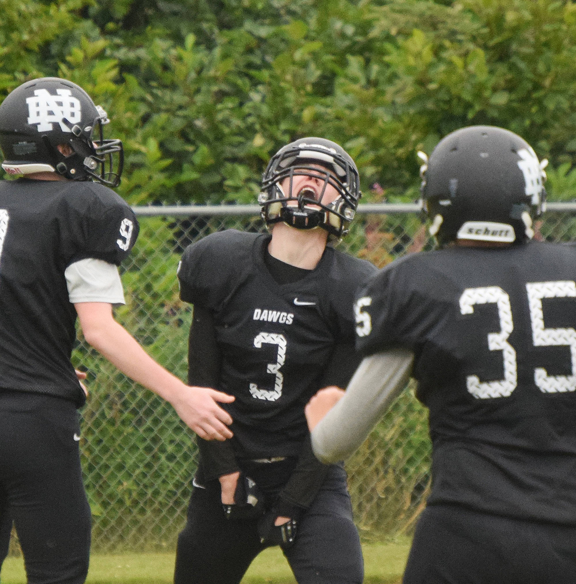 Nikiski junior Sam Berry (3) lets out a roar of celebration after scoring a touchdown early Aug. 18, 2018, against Valdez at Nikiski High School. (Photo by Joey Klecka/Peninsula Clarion)