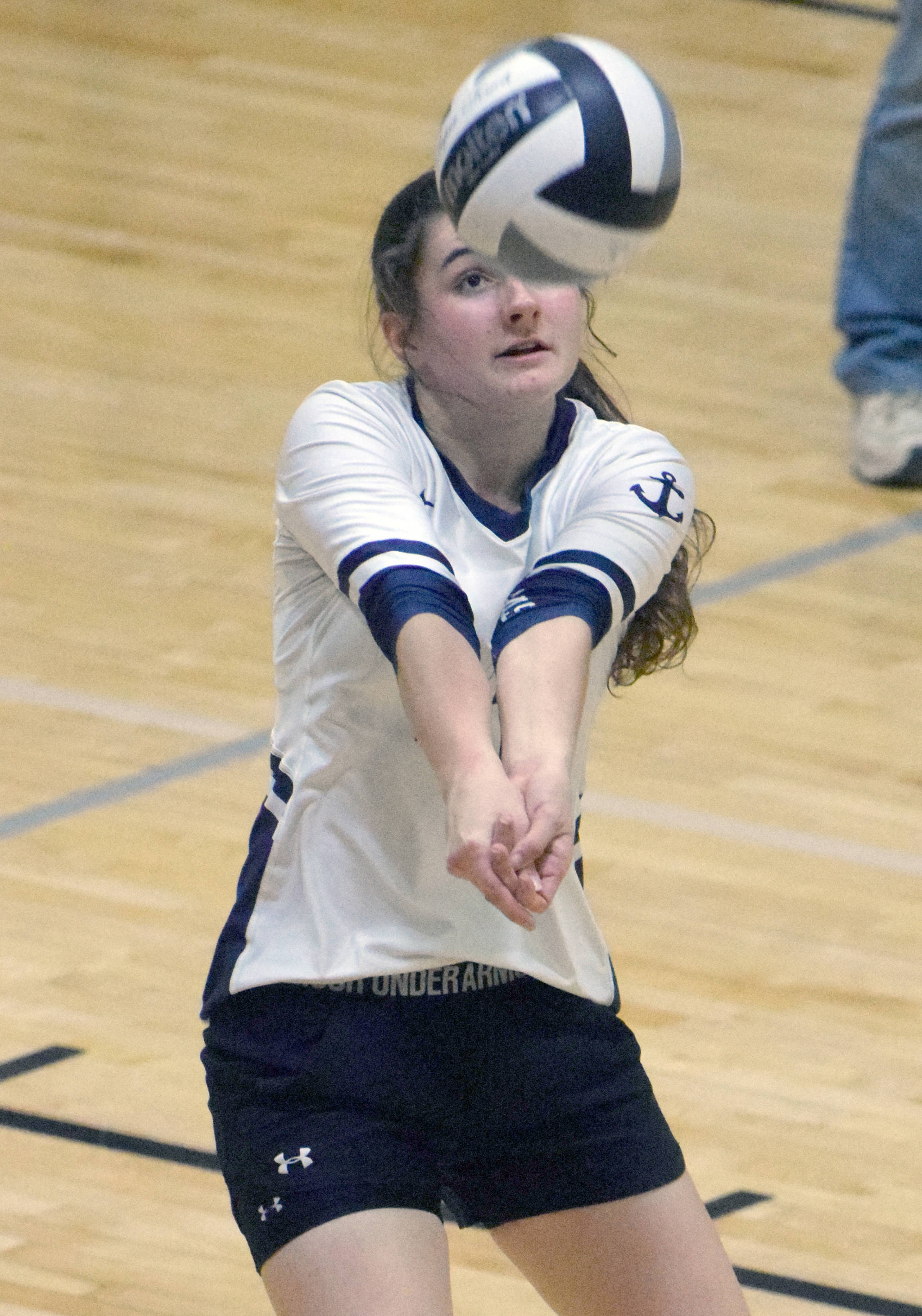 Marina Carroll digs up a ball for Homer against Nikiski on Saturday, Oct. 27, 2018, at Nikiski High School. (Photo by Jeff Helminiak/Peninsula Clarion)