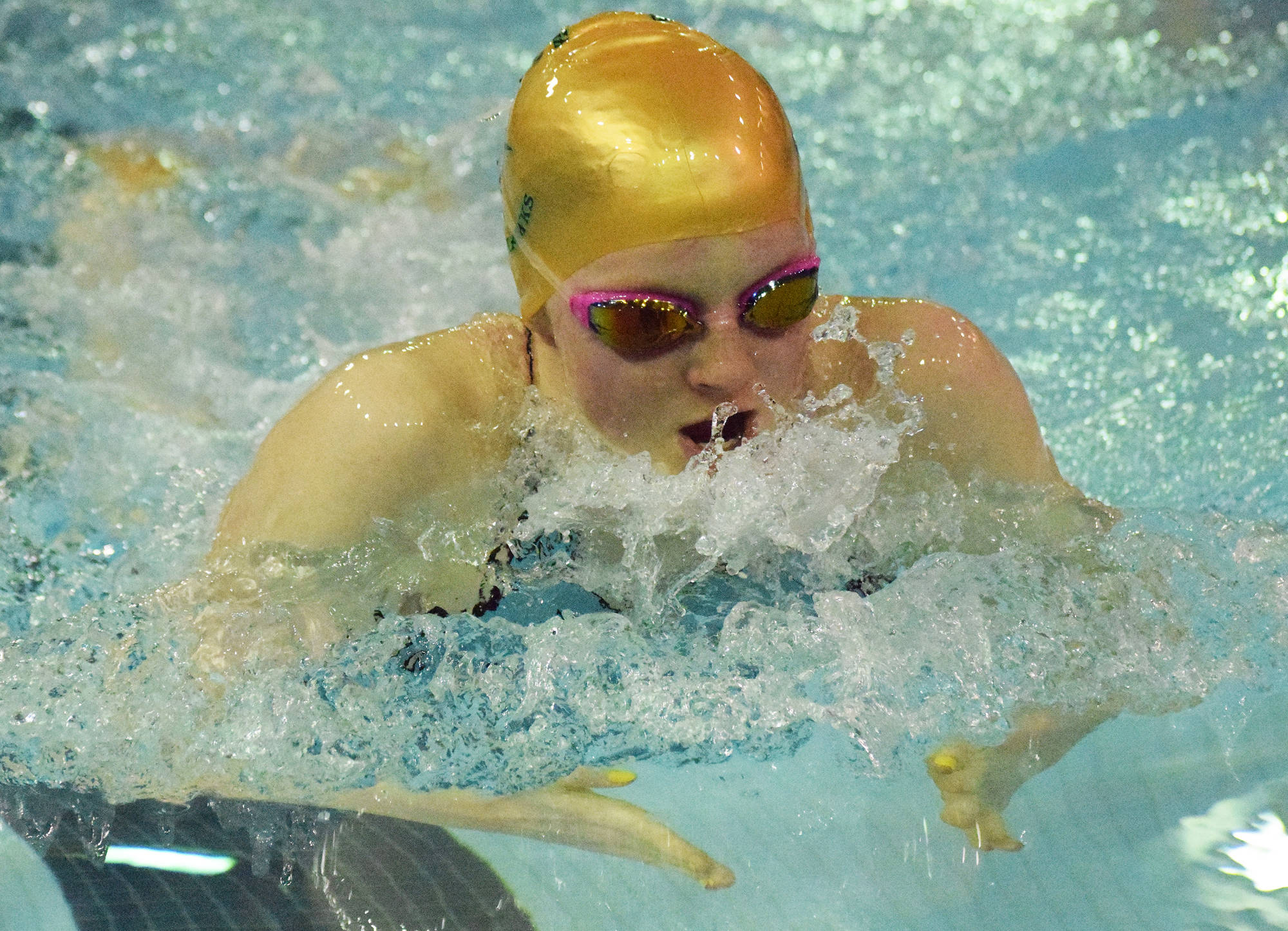 Seward’s Lydia Jacoby races to victory in the girls 100-yard breaststroke final Saturday at the Northern Lights Conference championship swim meet at Homer High School. (Photo by Joey Klecka/Peninsula Clarion)