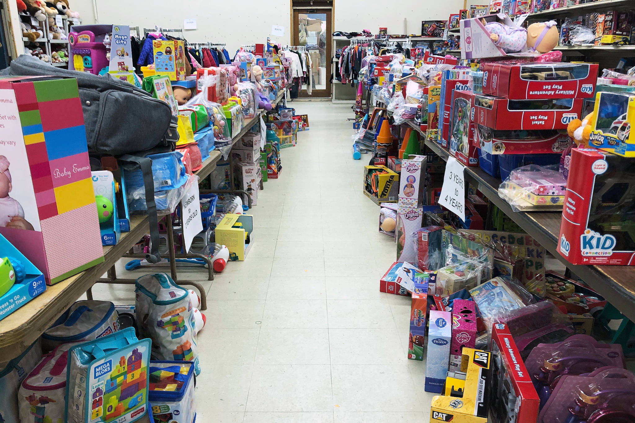 Rows of toys ready to be claimed by needy families sit on the backroom shelves of the Kenai Salvation Army Family Services store. (Photo by Joey Klecka/Peninsula Clarion)