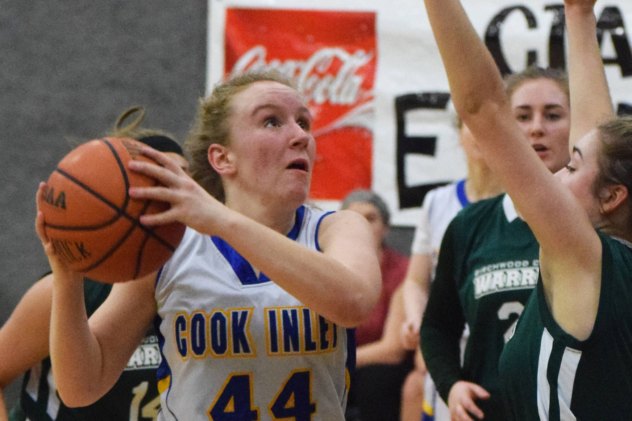 Cook Inlet Academy’s Adara Warren (44) steps back for a shot against a Birchwood Christian defender Feb. 27, 2019, at the Peninsula Conference championship tournament at Cook Inlet Academy in Soldotna. (Photo by Joey Klecka/Peninsula Clarion)