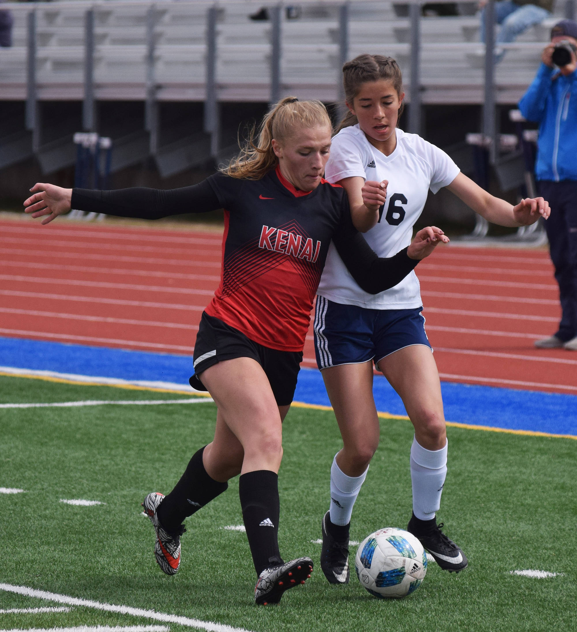 Kenai Central’s Damaris Severson (left) battles for the ball with Soldotna’s Sierra Kuntz last season in the Peninsula Conference girls soccer championship at Soldotna High School. (Photo by Joey Klecka/Peninsula Clarion)