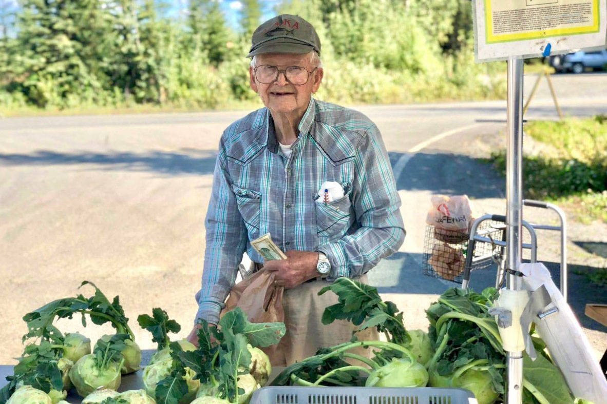 Dale Cocklin of Two Peas in a Pod Farm sells an abundance of root vegetables like beets, kohlrabi, carrots and more at his stand at the Farmers Fresh Market on Tuesday, Aug. 28 2018 at the Kenai Peninsula Food Bank, near Soldotna, Alaska. (Photo by Victoria Petersen/Peninsula Clarion)