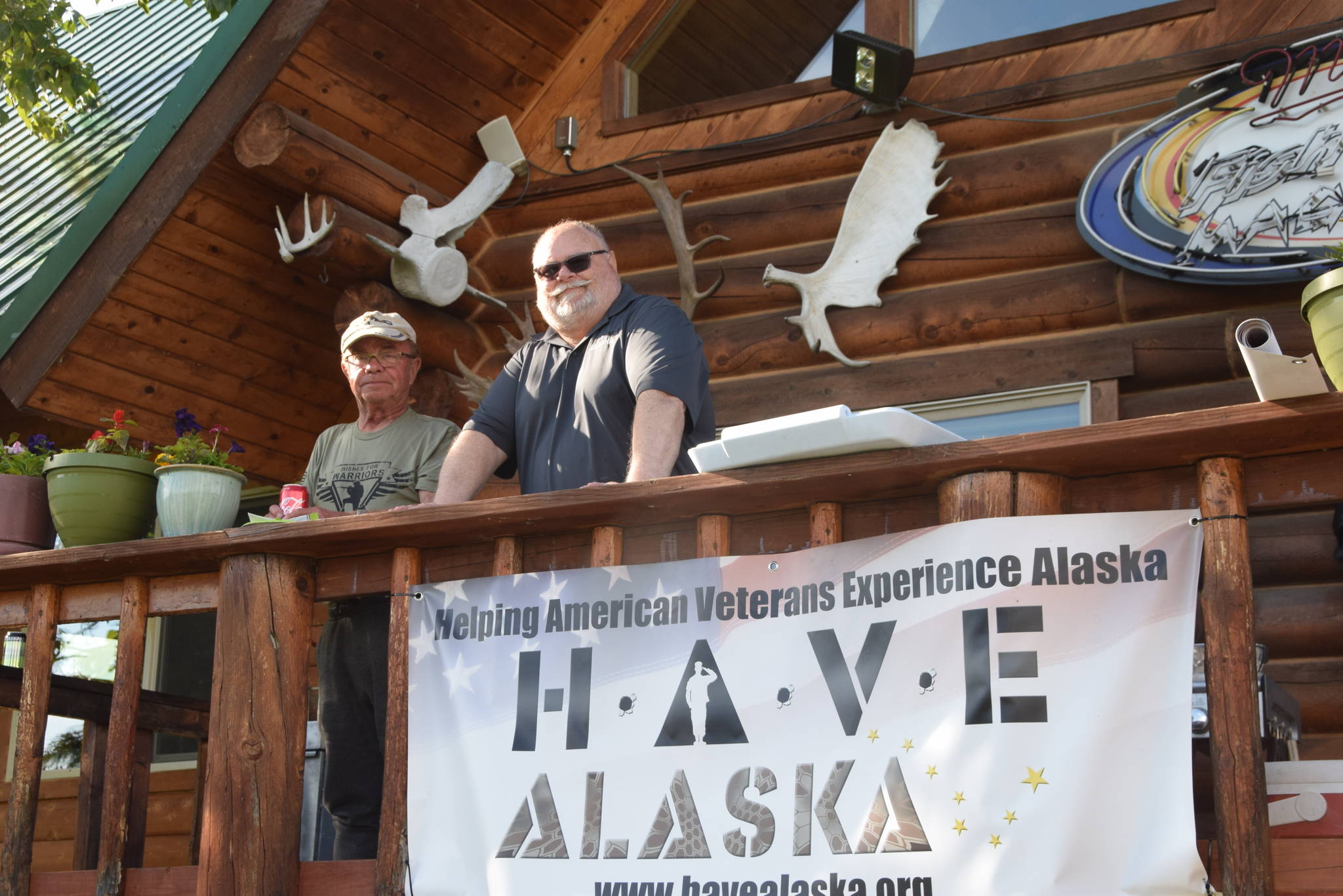 Sgt. 1st Class Gert Bindrich and Capt. Lee Halstead smile for the camera during HAVE-Alaska’s 2019 fishing trip in Soldotna, Alaska, on Wenesday, June 5, 2019. (Photo by Brian Mazurek/Peninsula Clarion)