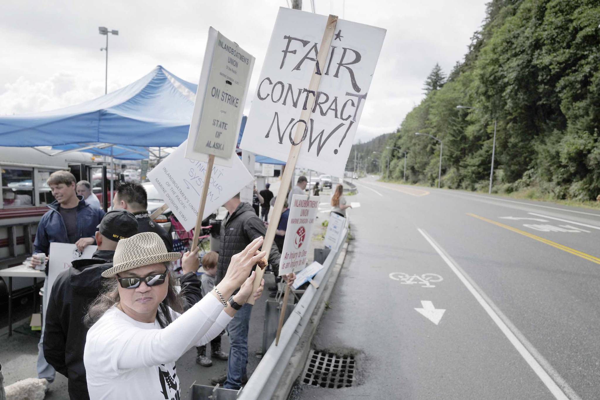 Michael Penn | Juneau Empire                                 Roland Lumbab mans the picket line with others on the third day of the Inland Boatmen’s Union of the Pacific’s strike against the Alaska Marine Highway System at the Auke Bay Terminal on Friday in Juneau.