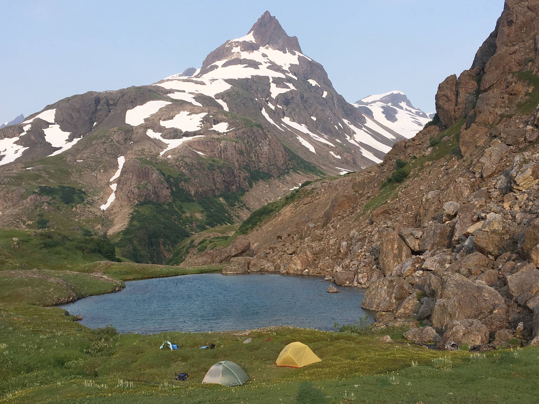 A pair of tents sits at the Infinity Pools above the Tutka Backdoor Trail on July 9, 2019. (Photo by Jeff Helminiak/Peninsula Clarion)