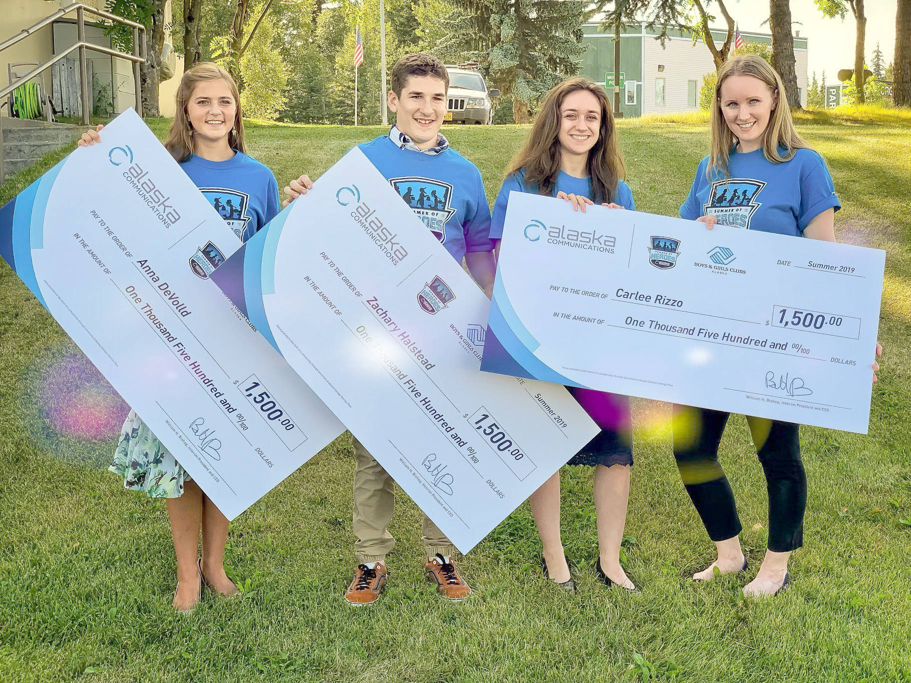 Photo courtesy of Pegge Erkeneff / Kenai Peninsula Borough School District                                Heather Marron, of Alaska Communications, presents the $1,500 awards to three Peninsula teens (from right) — Anna DeVolld, Zachary Halstead and Carlee Rizzo — who were honored in the Summer of Heroes program Monday in Soldotna.