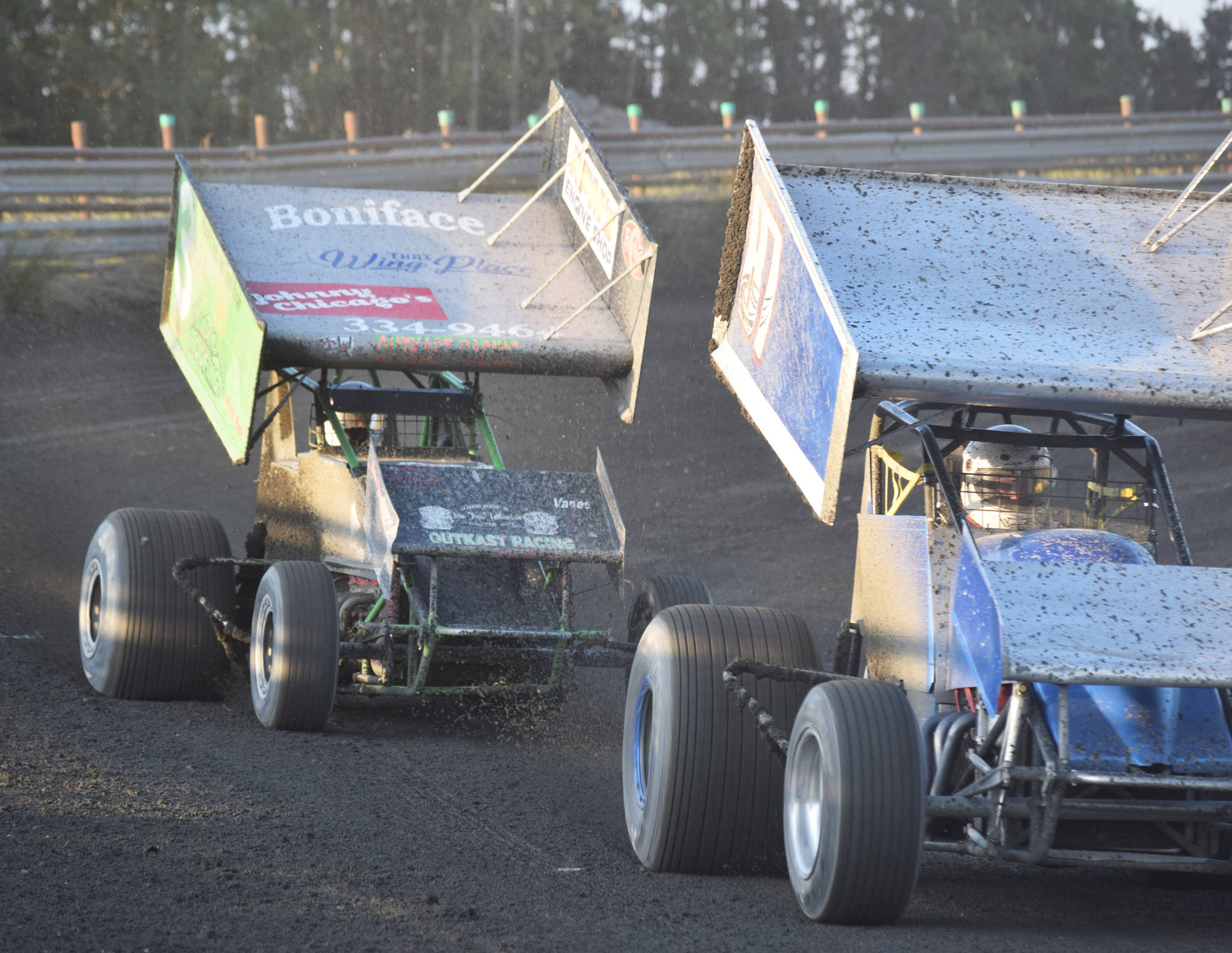 Sprint car driver Geoff Clark chases the lapped car of Dave Stephens Saturday, Aug. 10, 2019, at Twin City Raceway in Kenai, Alaska. (Photo by Joey Klecka/Peninsula Clarion)