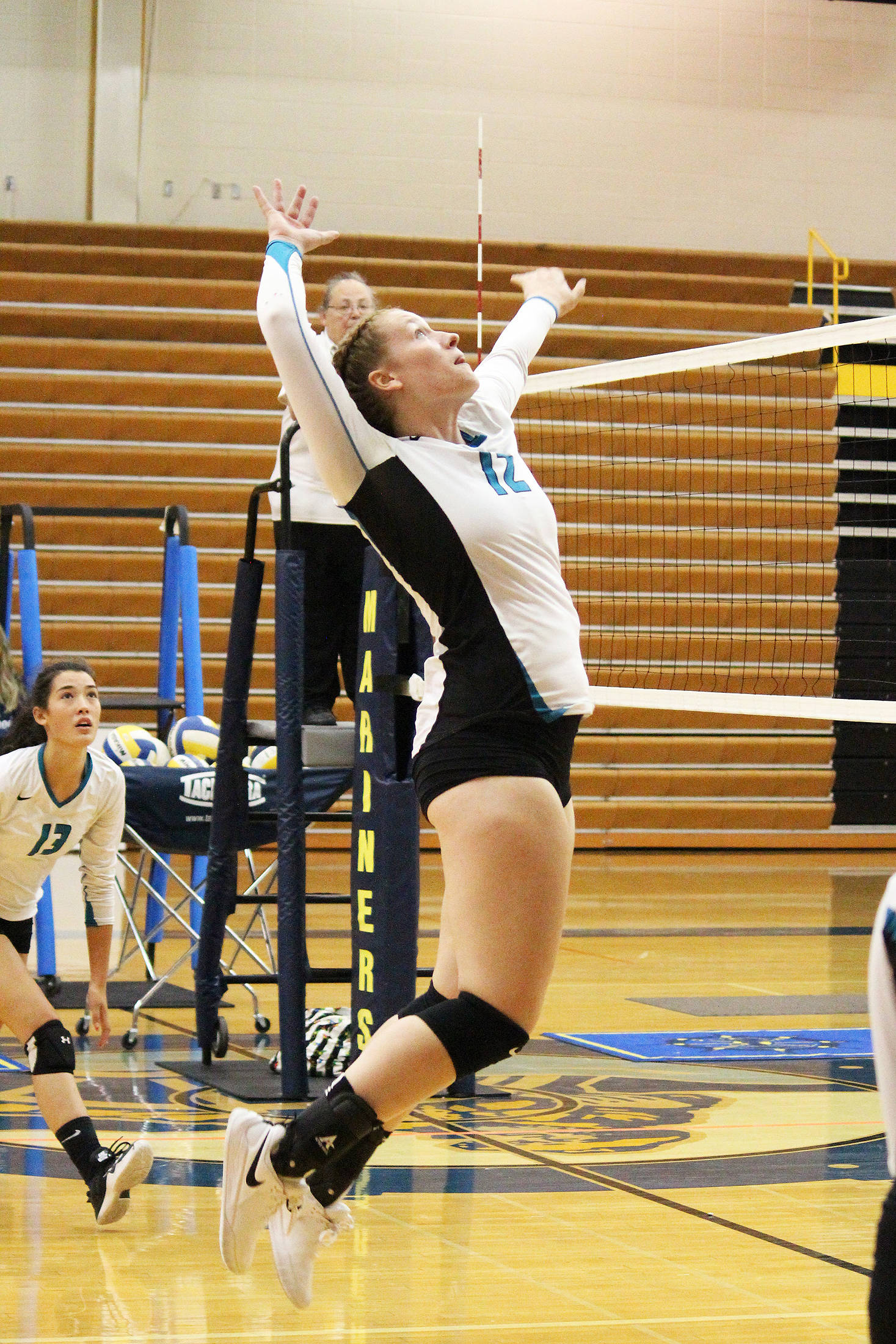 Kaycee Bostic jumps to spike the ball during the final game of the Homer Jamboree against the Homer Mariners on Saturday, Aug. 24, 2019 in the Alice Witt Gymnasium in Homer, Alaska. (Photo by Megan Pacer/Homer News)