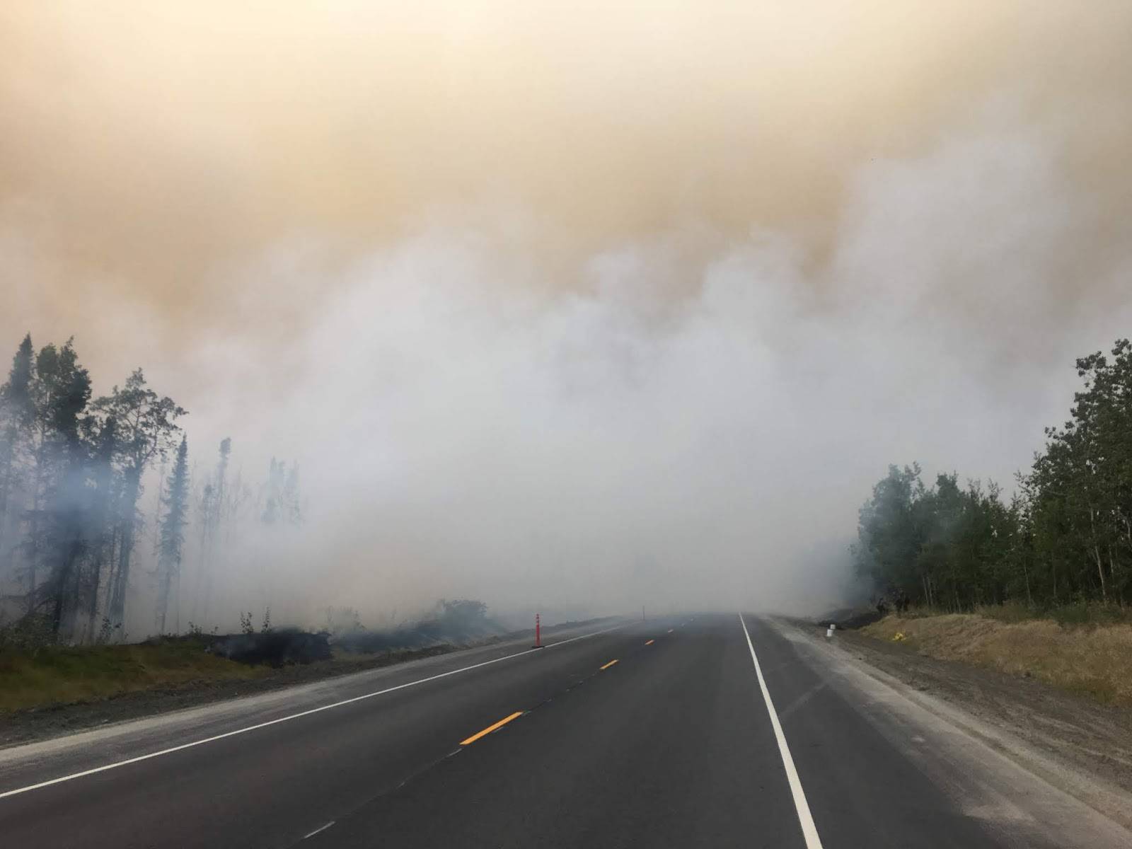 Fire activity can be seen on the Sterling Highway on Sunday, Aug. 26, 2019. (Photo courtesy of the Kenai Peninsula Borough Office of Emergency Management)