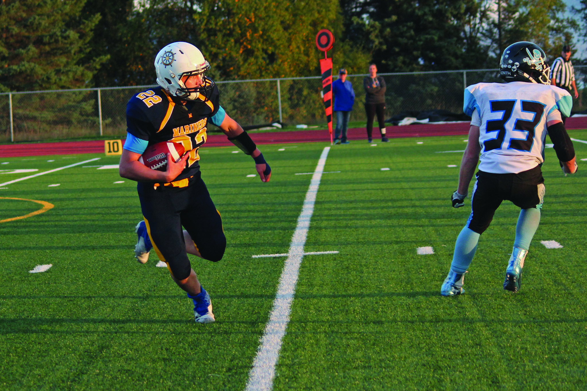 Homer’s Antonin Murachev runs the ball up the field during a Friday, Sept. 13, 2019 football game against Valdez High School at the Mariner field in Homer, Alaska. (Photo by Megan Pacer/Homer News)