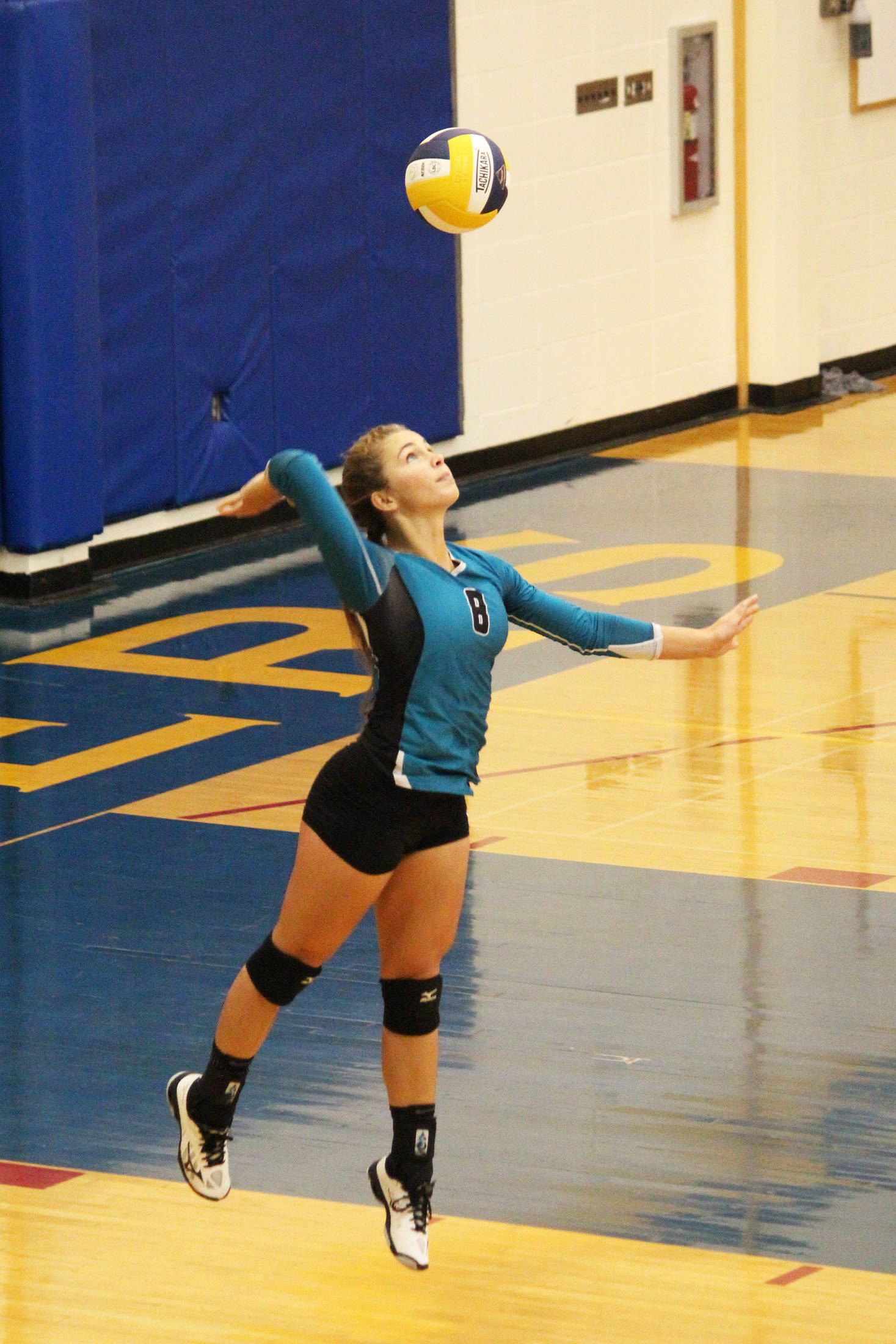 Nikiski’s Kaitlyn Johnson serves the ball to the Hoemr Mariners during a Saturday, Sept. 14, 2019 volleyball game at Homer High School in Homer, Alaska. (Photo by Megan Pacer/Homer News)