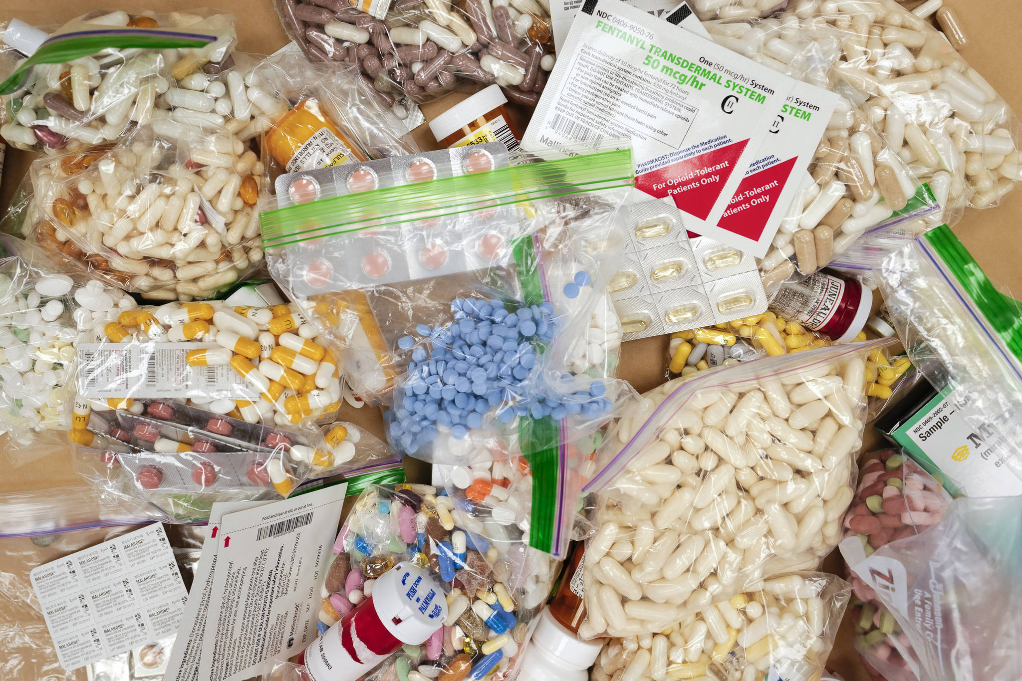 Prescriptions drugs, vitamins, hormones, and other drugs left in the drug drop box in the lobby of the Juneau Police Department displayed on Thursday, Sept. 26. The drop box gives residents a safe place to disposed of their unused prescription narcotics. (Michael Penn | Juneau Empire)