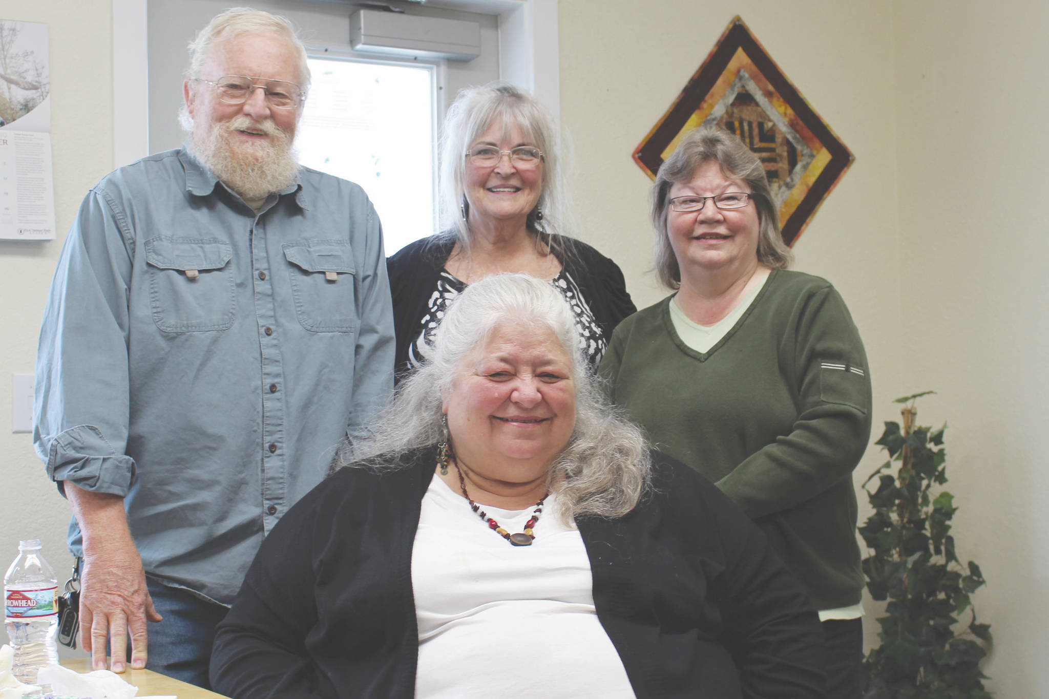 Brian Mazurek / Peninsula Clarion                                Grand Group members Joe Carlson (left), Nancy Carlson (front center), Sue Gill (back center) and Vicki Fruichantie smile for the camera Oct. 3 at the Children’s Advocacy Center in Kenai.