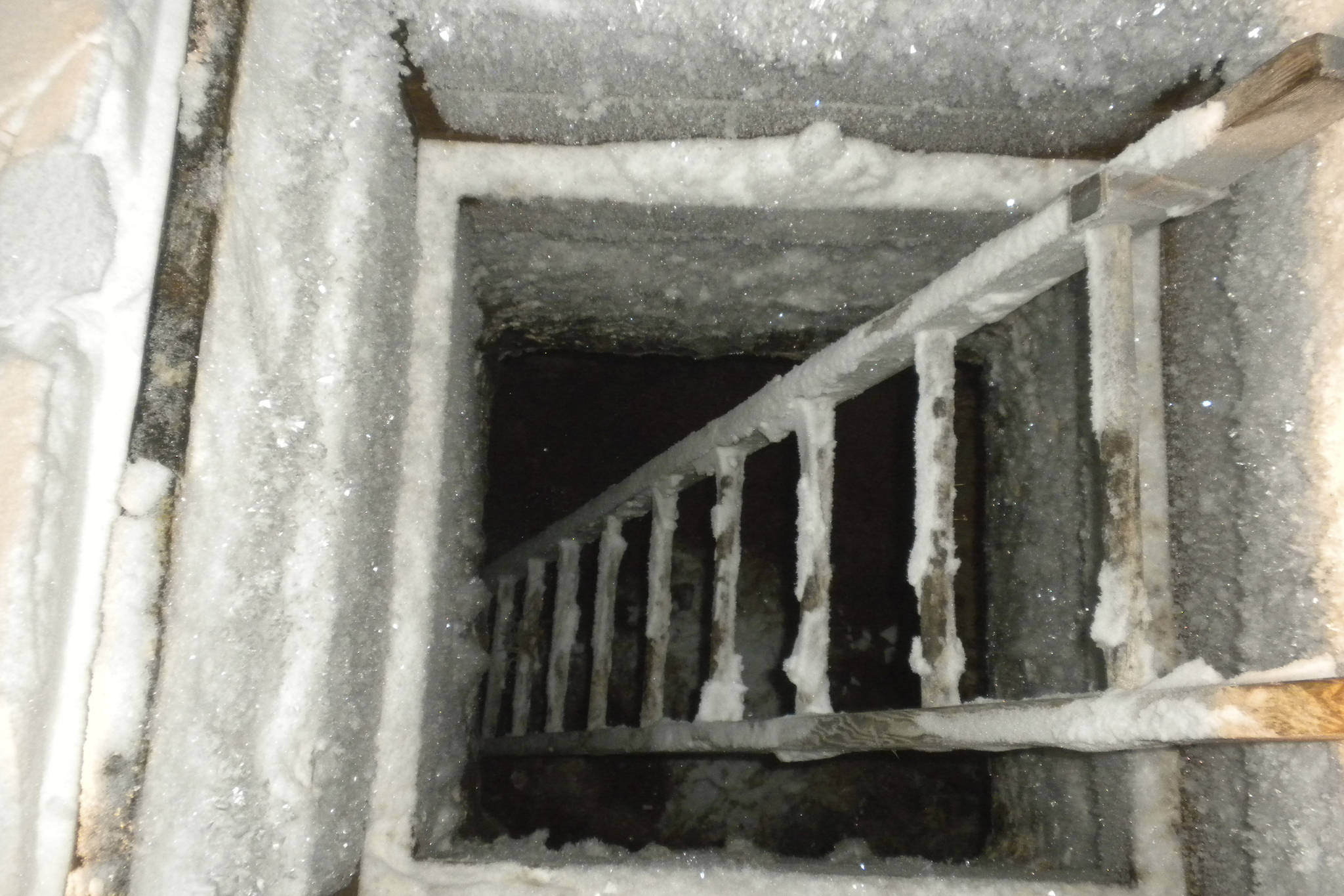 This Jan. 5, 2010, photo provided by the Alaska Native Tribal Health Consortium in Utqiagvik, Alaska, shows a functioning ice cellar, a type of underground food cache dug into the permafrost to provide natural refrigeration used for generations in far-north communities. Naturally cooled underground ice cellars, used in Alaska Native communities for generations, are becoming increasingly unreliable as a warming climate and other factors touch multiple facets of life in the far north. (Mike Brubaker/Alaska Native Tribal Health Consortium via AP)