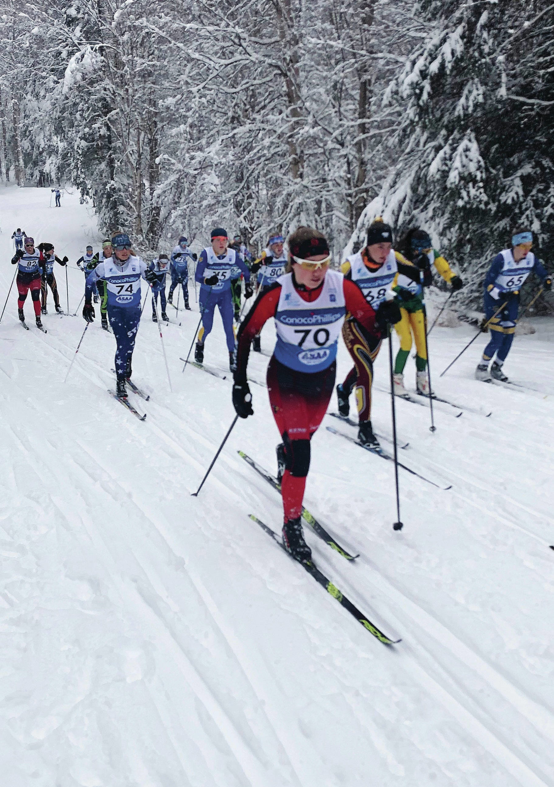 Kenai’s Gabriella Tews leads Soldotna’s Jordan Strausbaugh early in the girls 7.5-kilometer race Friday, Feb. 21, 2020, at the Alaska state Nordic ski championships at Kincaid Park in Anchorage. (Photo by Joey Klecka/For the Clarion)