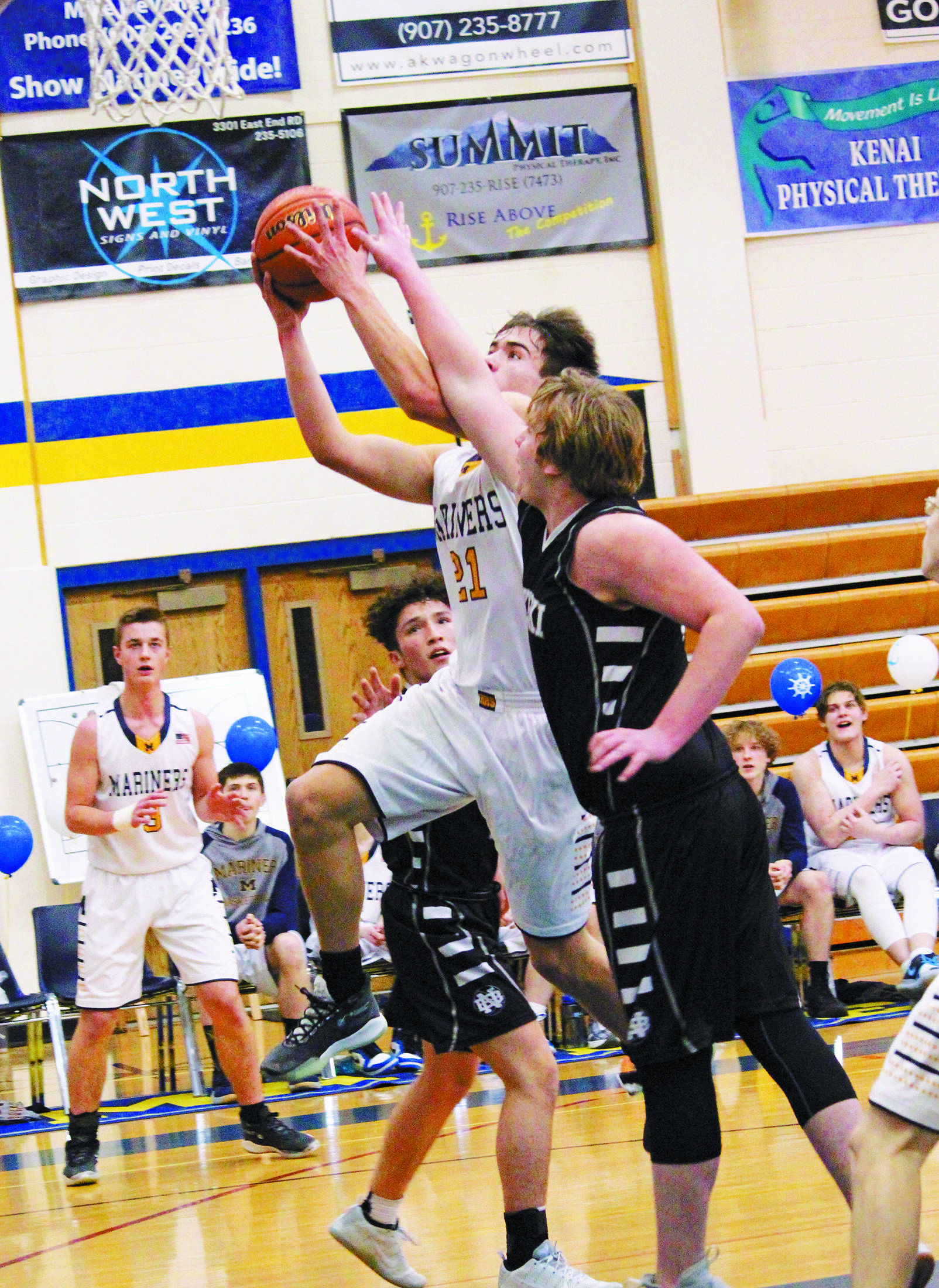 Homer’s Ethan Anderson goes up for a basket during a Friday, Feb. 28, 2020 basketball game against Nikiski Middle/High School in the Alice Witte Gymnasium in Homer, Alaska. (Photo by Megan Pacer/Homer News)