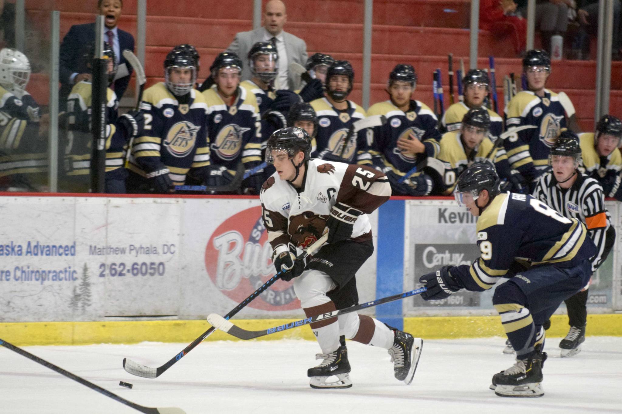 Kenai River Brown Bears defenseman Preston Weeks moves the puck up the ice against the Janesville (Wisconsin) Jets on Friday, Oct. 11, 2019, at the Soldotna Regional Sports Complex in Soldotna, Alaska. (Photo by Jeff Helminiak/Peninsula Clarion)