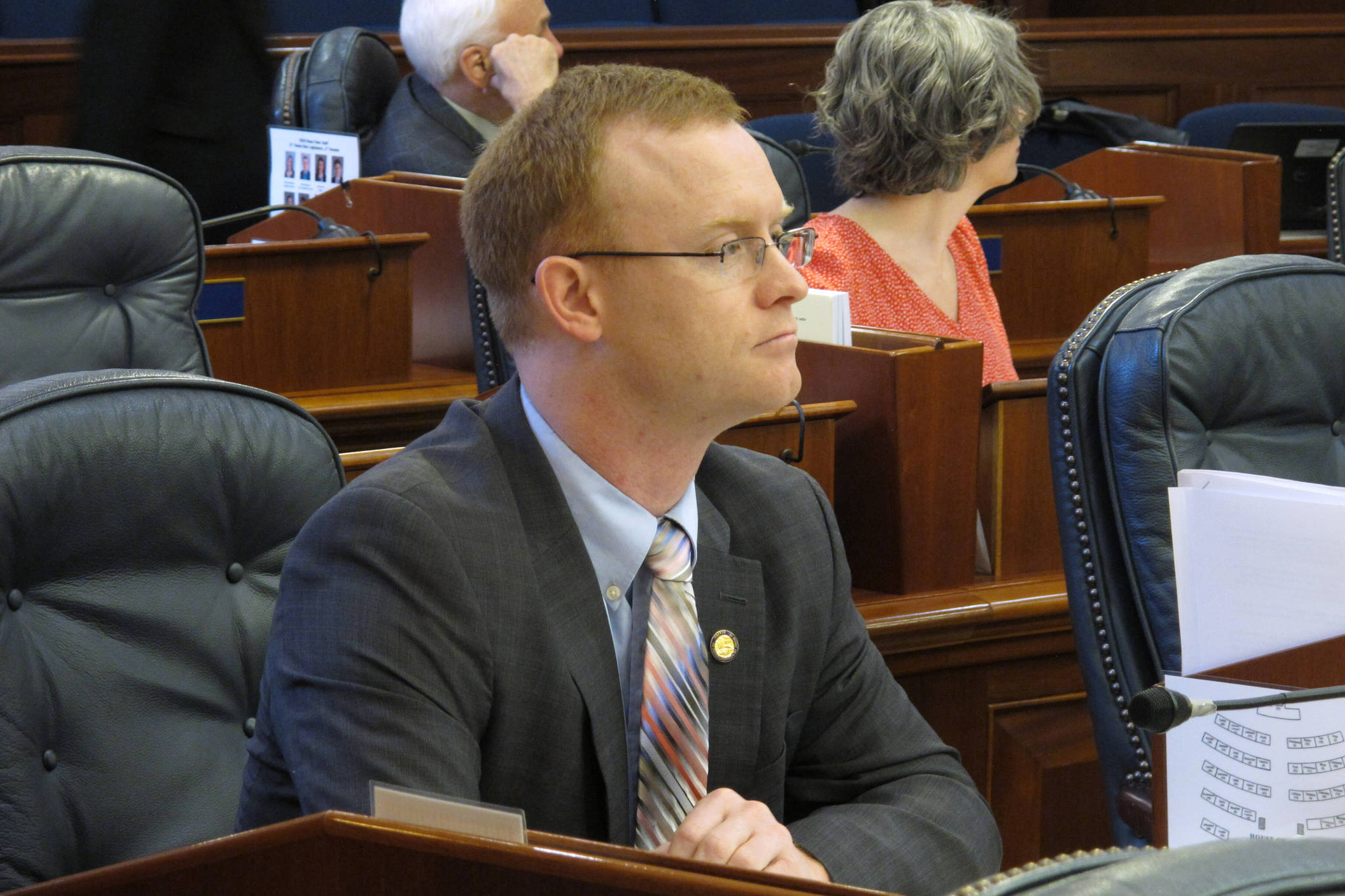 Alaska Rep. David Eastman sits at his desk on the Alaska House floor on Thursday, March 5, 2020, in Juneau, Alaska. The House voted Thursday to remove Eastman, a Wasilla Republican, from committee positions after House Minority Leader Lance Pruitt indicated frustrations with Eastman within the GOP caucus. (AP Photo/Becky Bohrer)