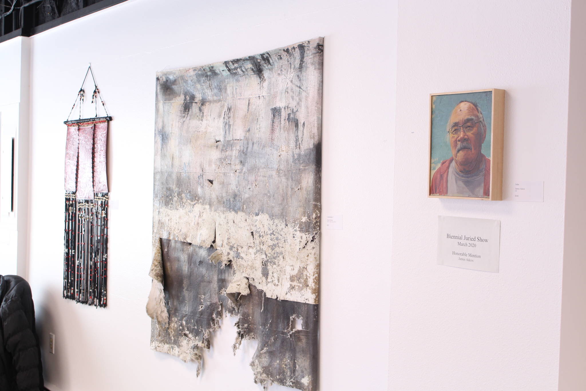 Pieces by local artists Susie Scrivner, left, Anna Widman, center, and James Adcox, right, are seen here on display at the Kenai Fine Art Center in Kenai, Alaska on March 18, 2020. (Photo by Brian Mazurek/Peninsula Clarion)