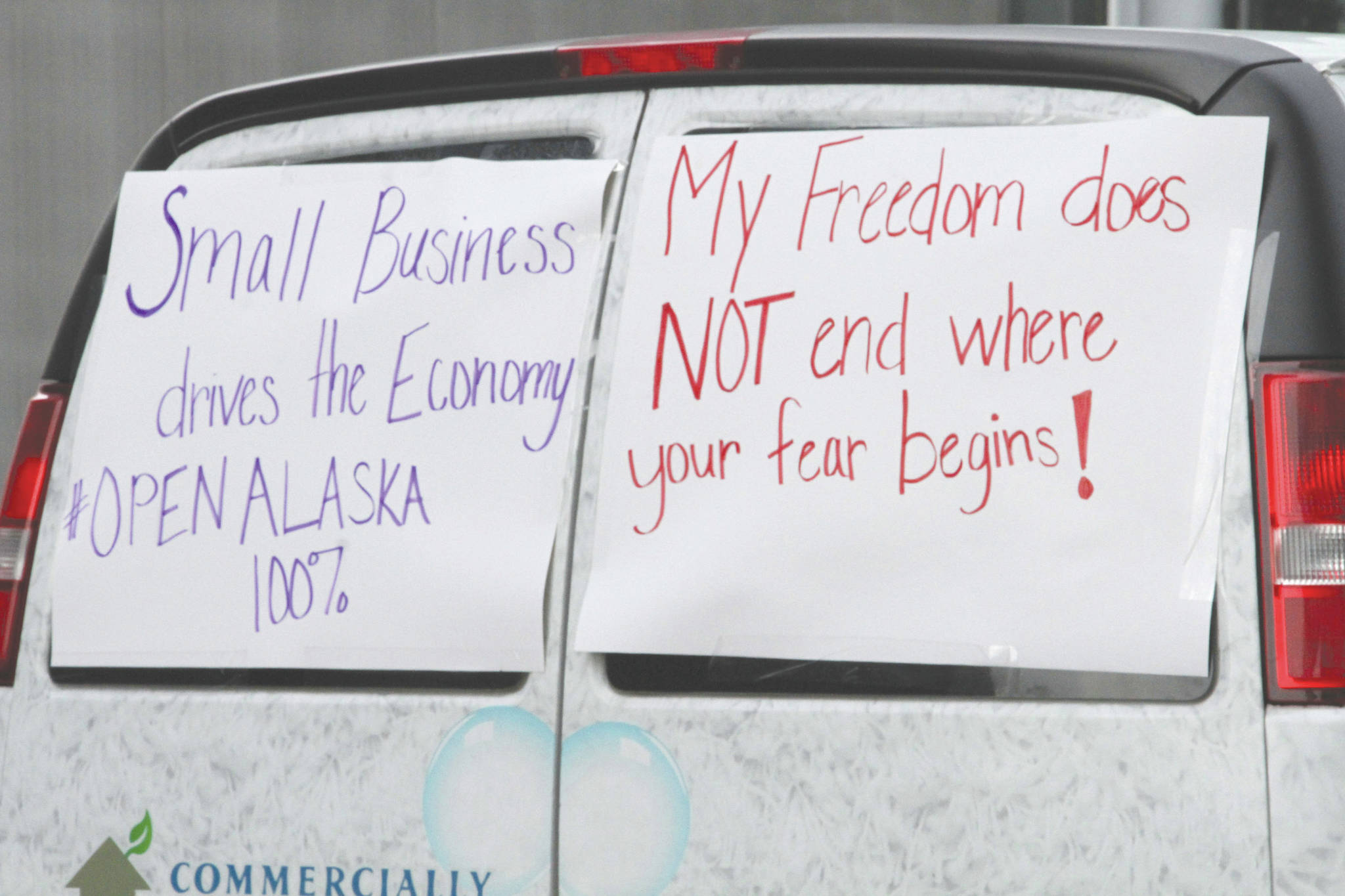 Mark Thiessen / associated press                                 A commercial van with signs on its back windows is driven through downtown Anchorage on Wednesday as part of a caravan of more than 80 vehicles. Participants urged local and state leaders to open up businesses shuttered temporarily while residents were told to stay home. The state will allow some businesses to open Friday, and the city of Anchorage will allow some Monday.