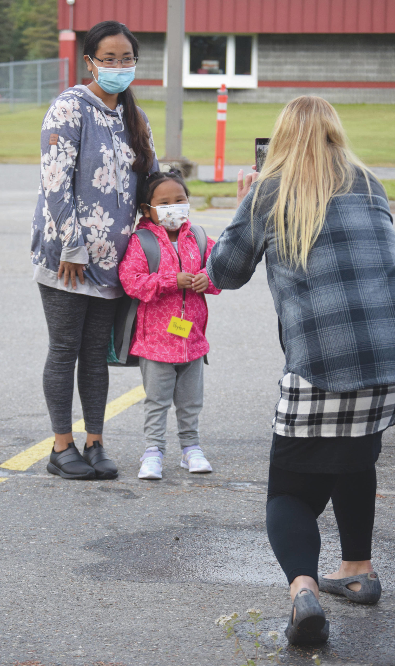 Jeff Helminiak / Peninsula Clarion                                Mollie Kirk and her daughter, Peyton, pose for a photo Monday for kindergarten teacher Cynthia Fudzinski at Mountain View Elementary School in Kenai.