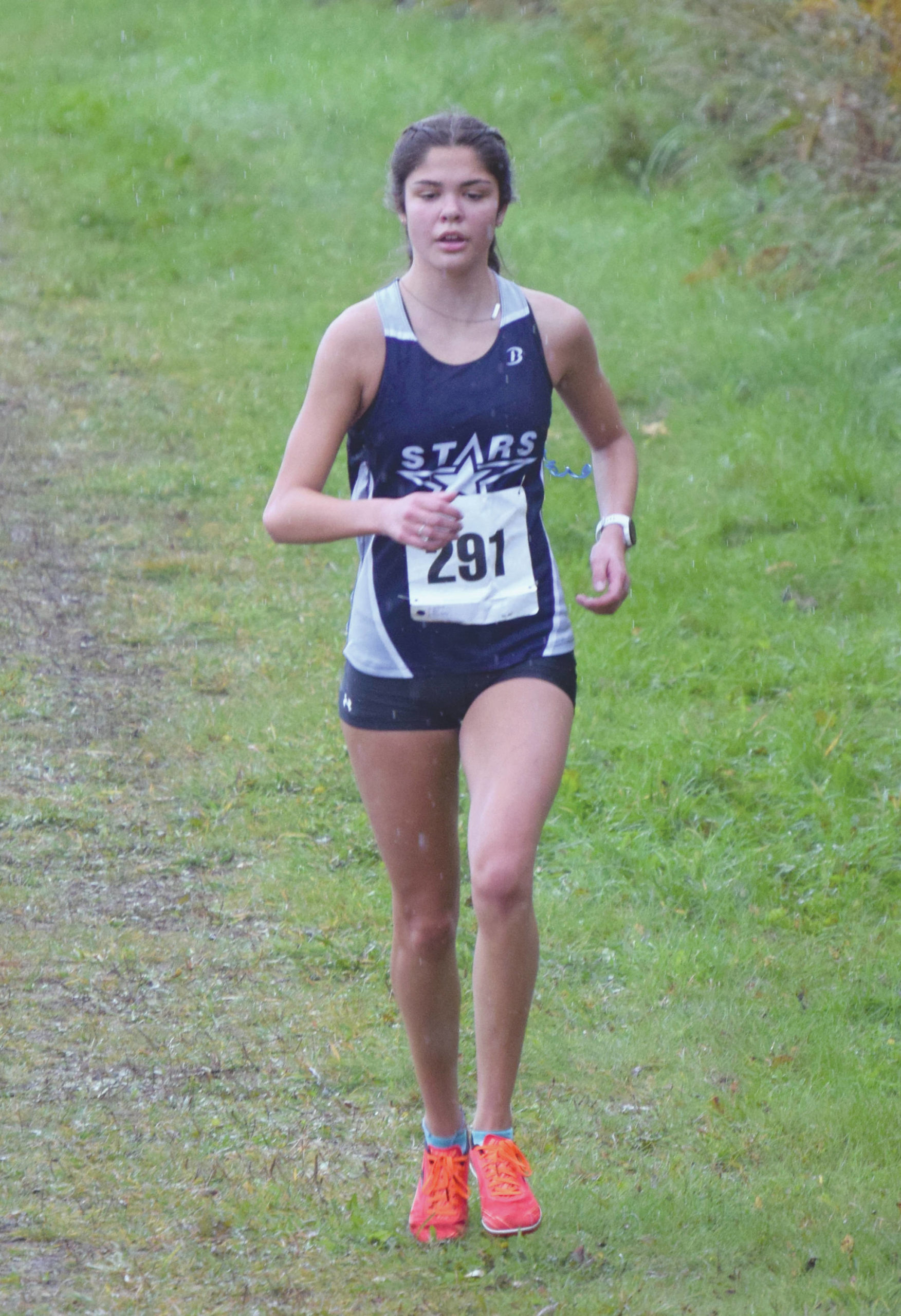 Soldotna’s Erika Arthur runs to second place in the Kenai Peninsula Borough cross-country race Saturday, Sept. 26, 2020, at Tsalteshi Trails just outside of Soldotna, Alaska. (Photo by Jeff Helminiak/Peninsula Clarion)