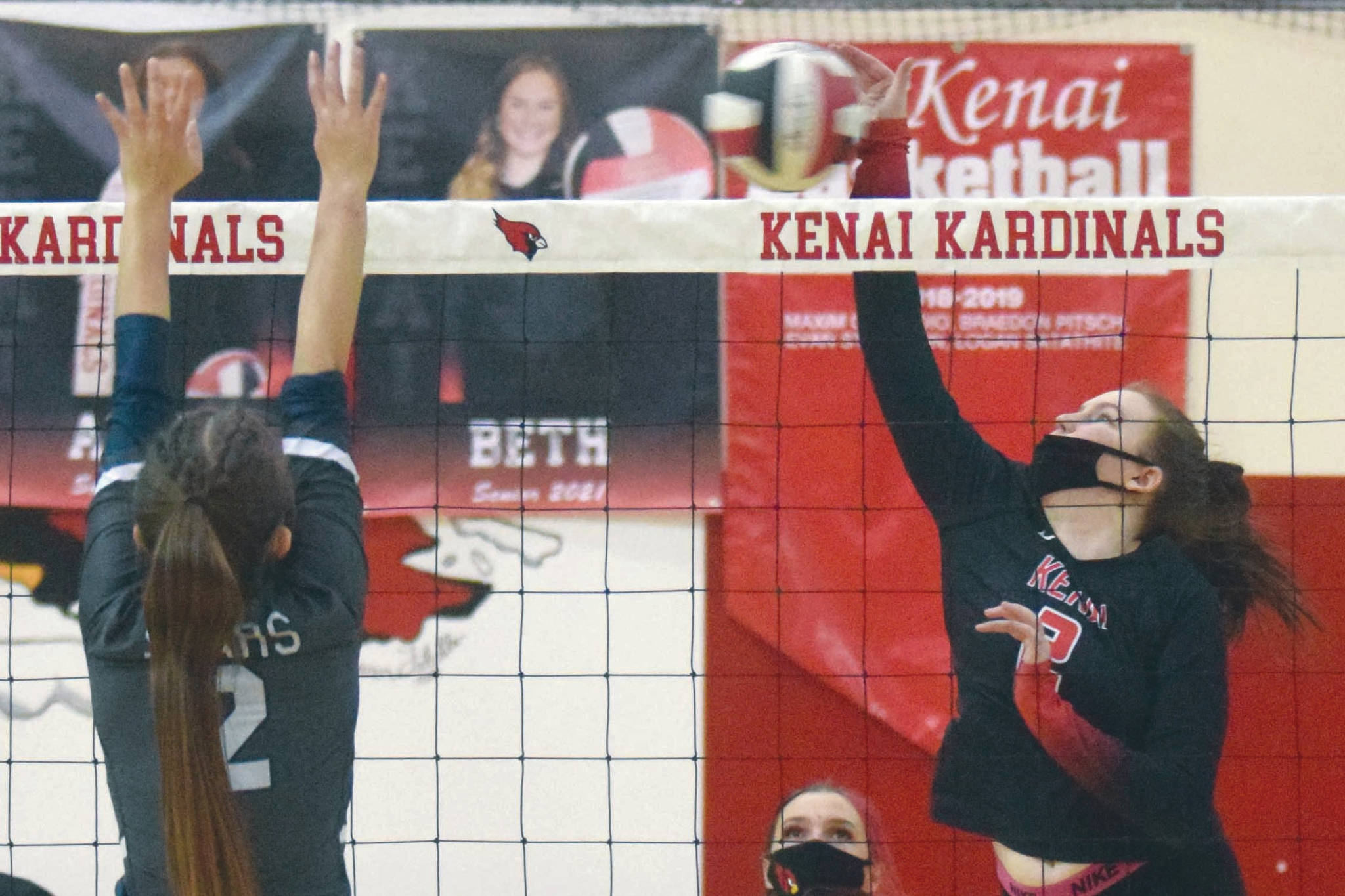 Kenai Central's Bethany Morris attacks Soldotna's Sierra Kuntz on Saturday, Nov. 7, 2020, at Kenai Central High School in Kenai, Alaska. (Photo by Jeff Helminiak/Peninsula Clarion)