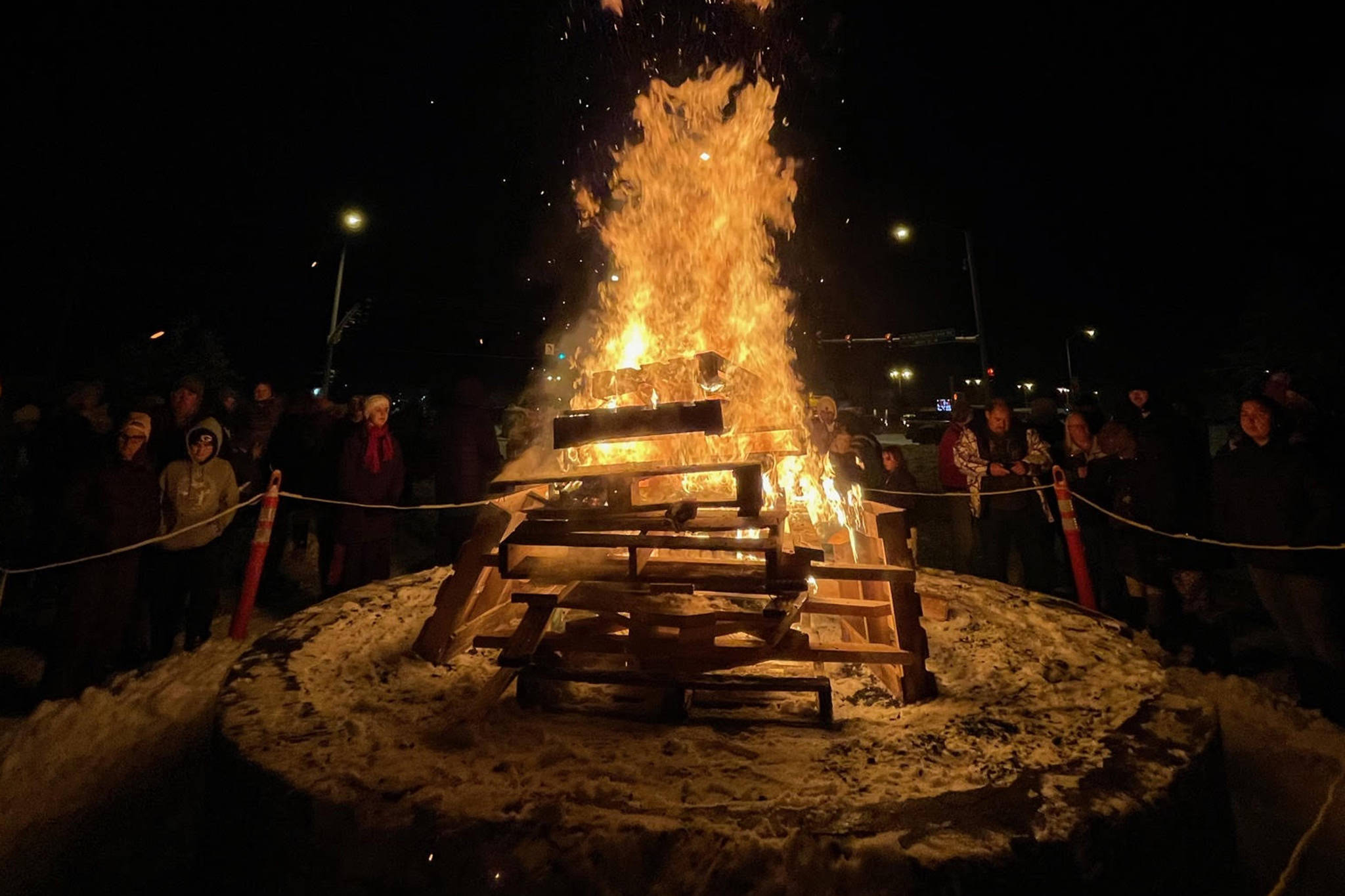 Photo courtesy Brittany Brown/Kenai Chamber of Commerce
Attendees of the 2020 Christmas Comes to Kenai parade gather around the bonfire outside the Kenai Visitors and Cultural Center.