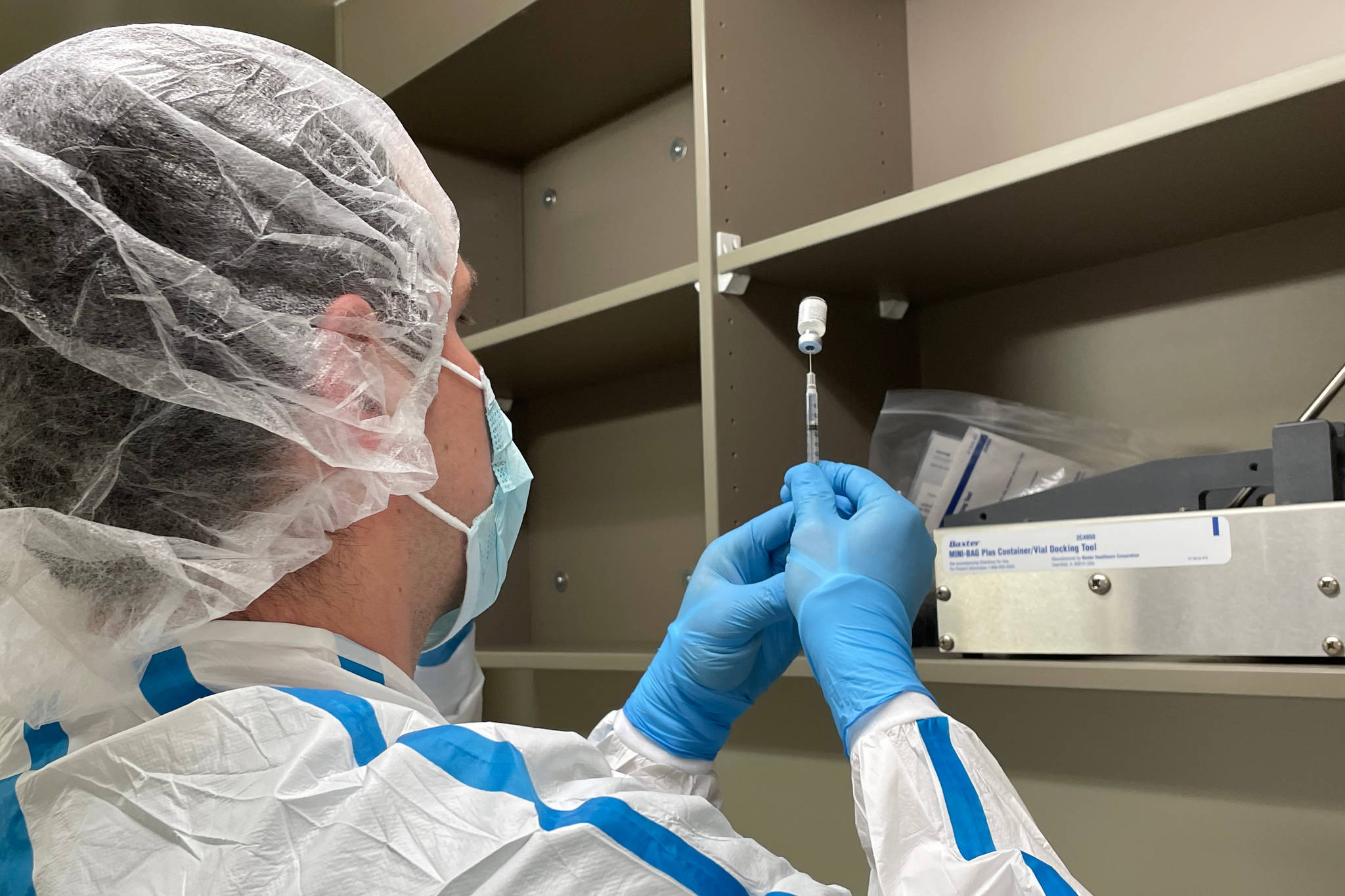 Courtesy photo / Katie Bausler
Krischelle Batac, a pharmacy technician with Bartlett Regional Hospital, prepares the first dose of the Pfizer/BioNTech coronavirus vaccine on Tuesday.