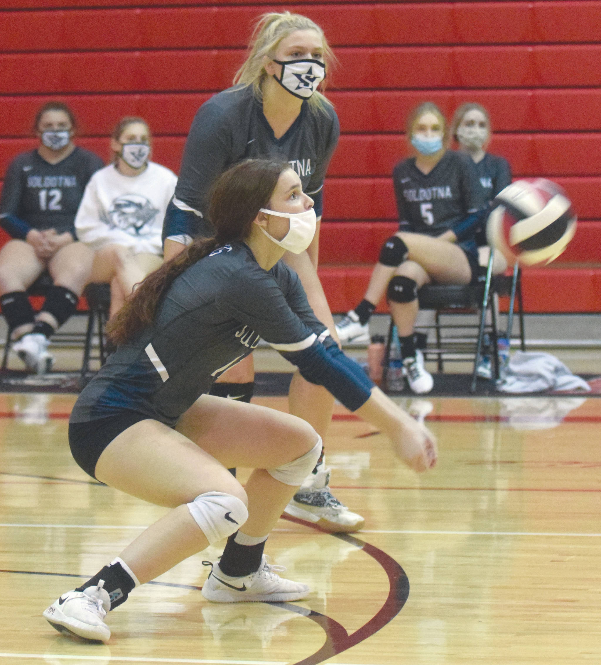 Soldotna’s Morgan Bouschor digs up a ball against Kenai Central on Nov. 7, 2020, at Kenai Central High School at the Kenai Peninsula Volleyball Championships. (Photo by Jeff Helminiak/Peninsula Clarion)