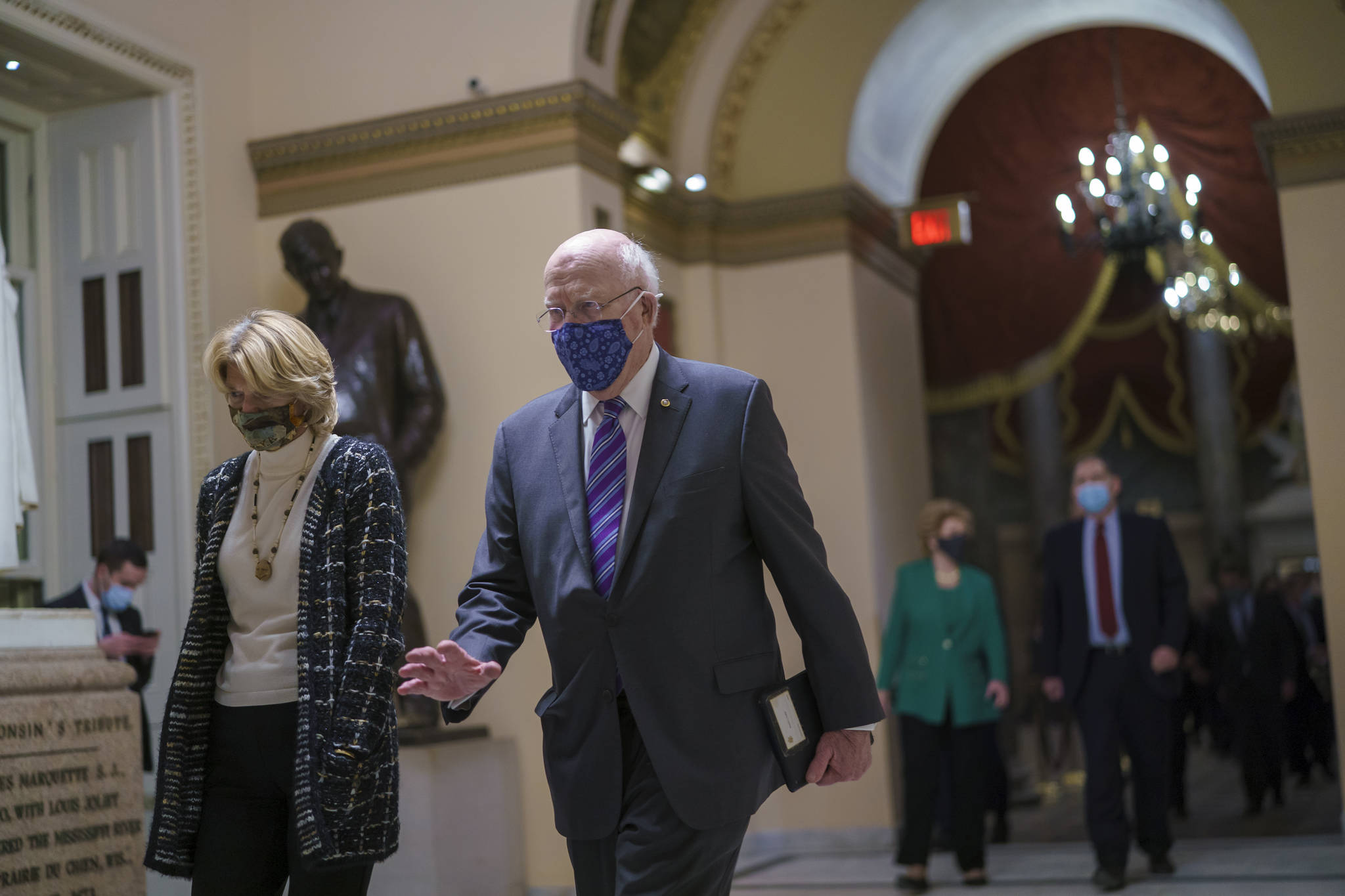 Associated Press
U.S. Sen. Lisa Murkowski, R-Alaska, and Sen. Patrick Leahy, D-Vermont, join other senators as they return to the House chamber to continue a joint session of the House and Senate and count the Electoral College votes on Jan. 6.