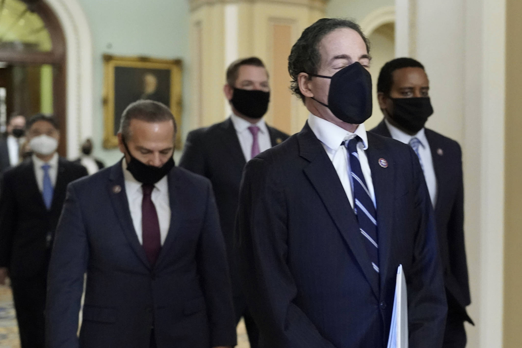 Democratic House impeachment managers from left, Rep. David Cicilline, D-R.I., Rep. Eric Swalwell, D-Calif., Rep. Jamie Raskin, D-Md., and Rep. Joe Neguse, D-Colo.,walk out of the Senate Chamber in the Capitol at the end of the fifth day of the second impeachment trial of former President Donald Trump, Saturday, Feb. 13, 2021, in Washington. The Senate has acquitted Donald Trump of inciting the Jan. 6 attack on the U.S. Capitol, bringing his trial to a close and giving the former president a historic second victory in the court of impeachment. (AP Photo/J. Scott Applewhite)